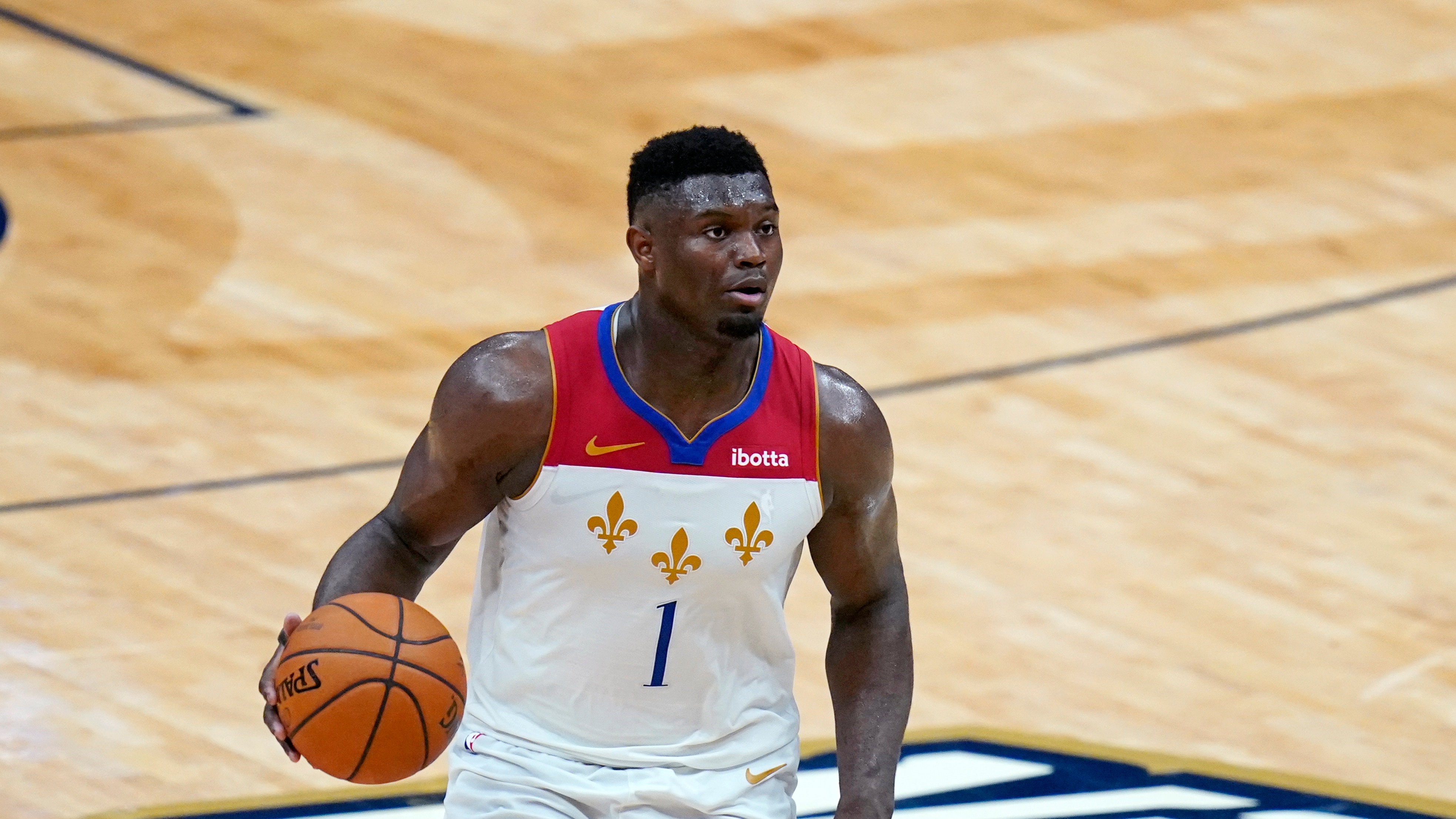 New Orleans Pelicans forward Zion Williamson (1) moves the ball up court in the second half of an NBA basketball game against the Golden State Warriors in New Orleans, Tuesday, May 4, 2021. (AP Photo/Gerald Herbert)