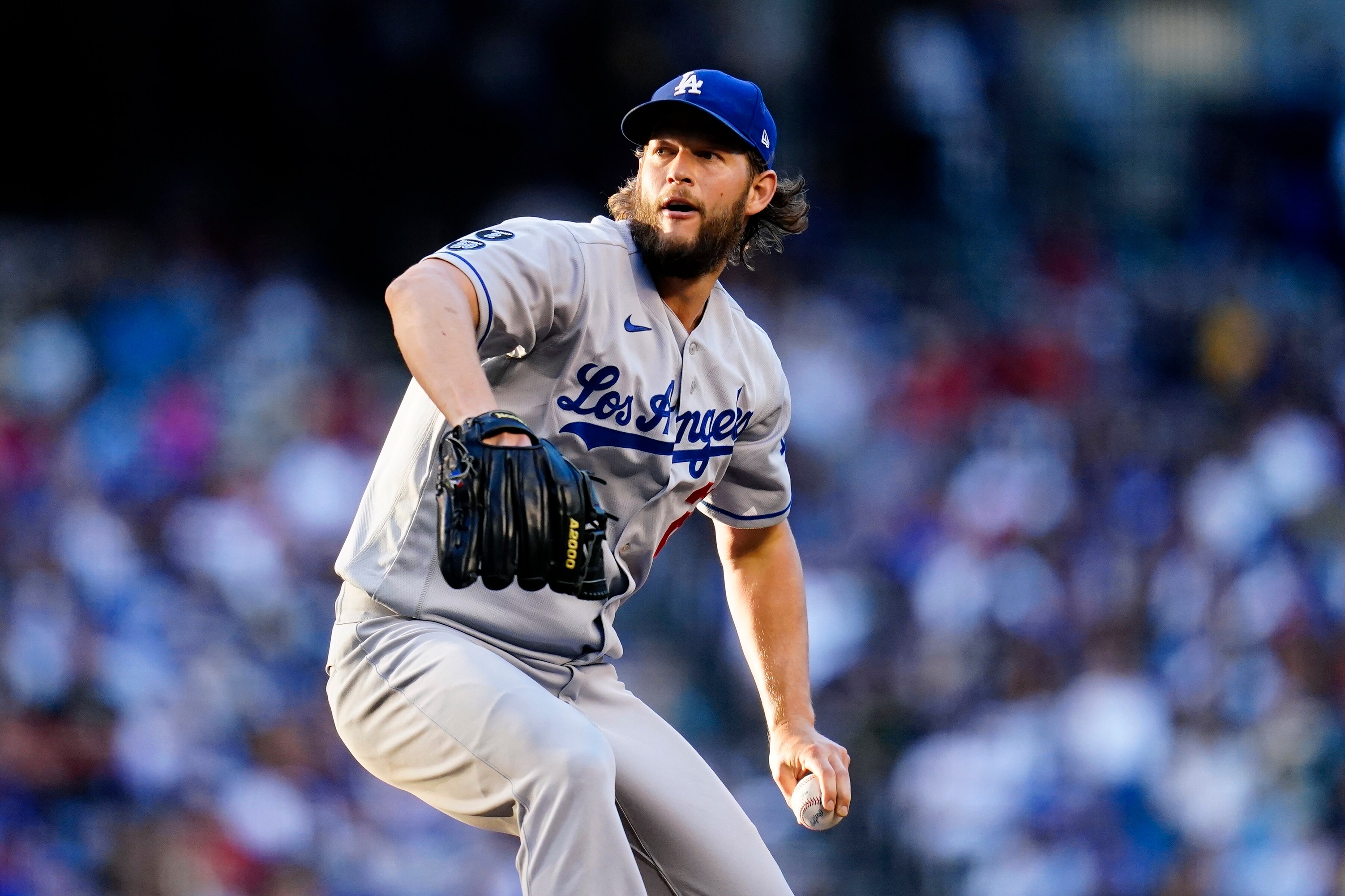 Los Angeles Dodgers starting pitcher Clayton Kershaw throws a pitch against the Arizona Diamondbacks during the second inning of a baseball game Saturday, Sept. 25, 2021, in Phoenix. (AP Photo/Ross D. Franklin)