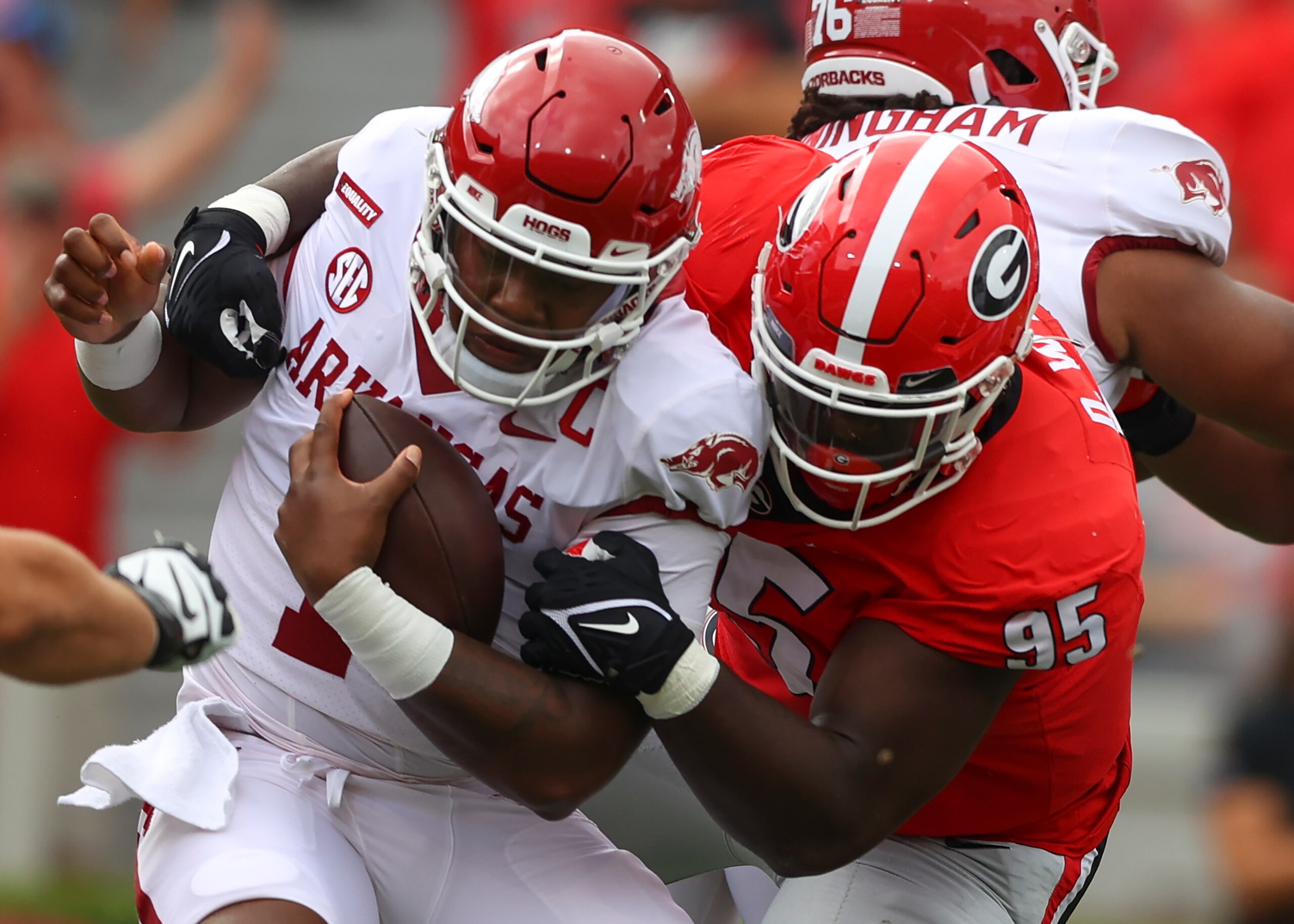 ATHENS, GA - OCTOBER 02: KJ Jefferson #1 of the Arkansas Razorbacks is wrapped up by Devonte Wyatt #95 of the Georgia Bulldogs in the first half at Sanford Stadium on October 2, 2021 in Athens, Georgia. (Photo by Todd Kirkland/Getty Images)