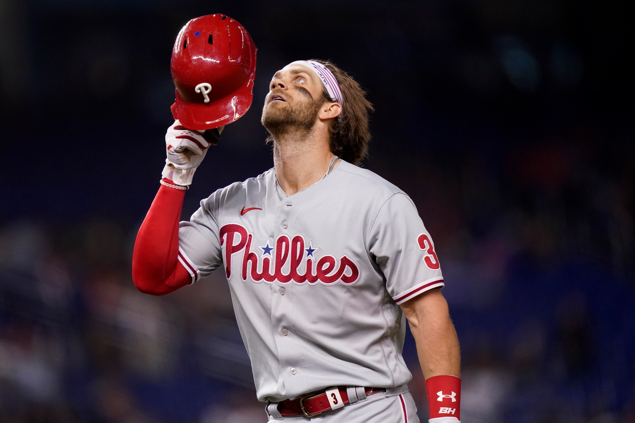 Philadelphia Phillies' Bryce Harper walks to the dugout after being thrown out during the ninth inning of a baseball game against the Miami Marlins, Friday, Oct. 1, 2021, in Miami.The Phillies won 5-0. (AP Photo/Lynne Sladky)
