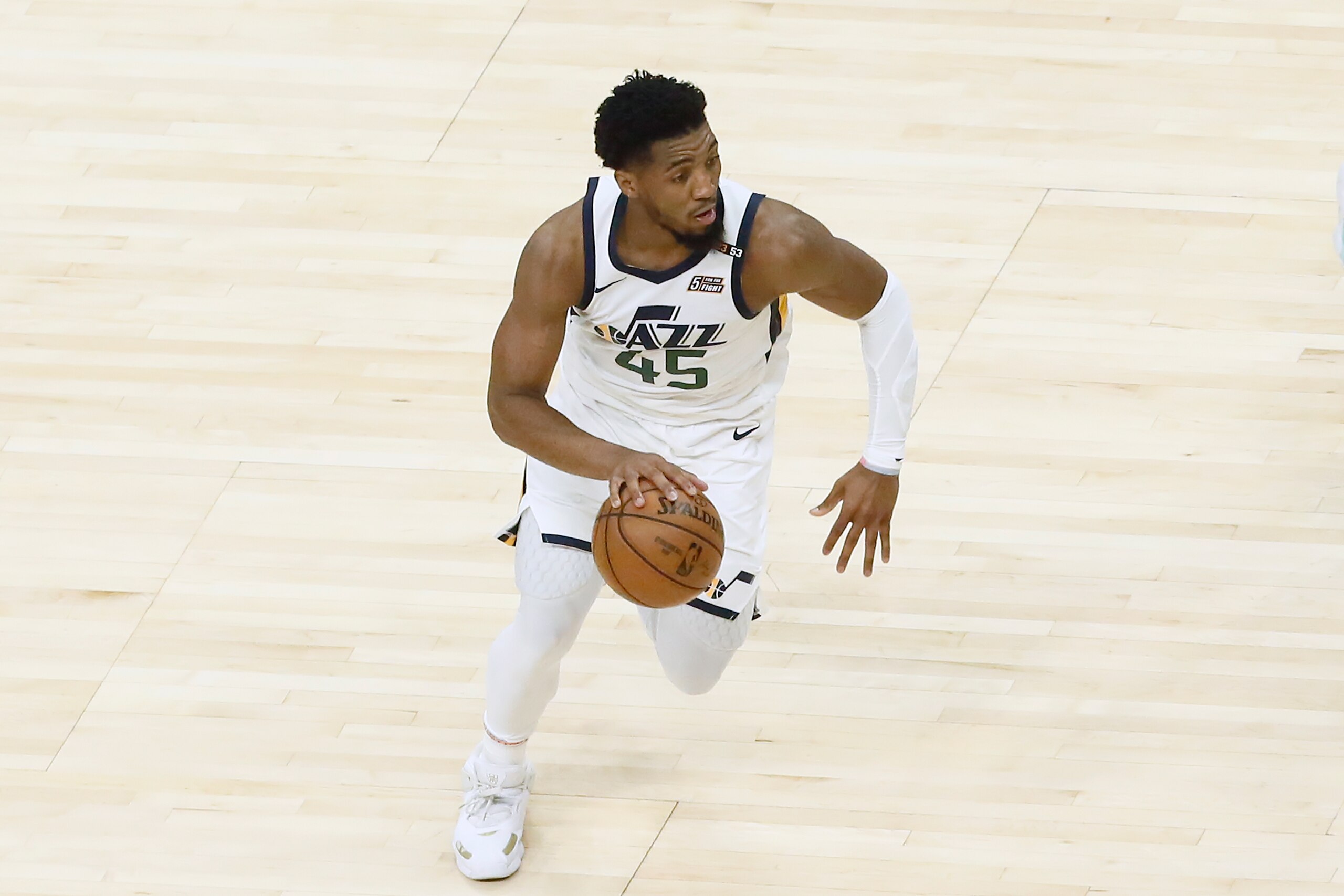 LOS ANGELES, CA - JUNE 18: Donovan Mitchell #45 of the Utah Jazz dribbles the ball during the game against the LA Clippers during Round 2, Game 6 of the 2021 NBA Playoffs on June 18, 2021 at STAPLES Center in Los Angeles, California. NOTE TO USER: User expressly acknowledges and agrees that, by downloading and/or using this Photograph, user is consenting to the terms and conditions of the Getty Images License Agreement. Mandatory Copyright Notice: Copyright 2021 NBAE (Photo by Chris Elise/NBAE via Getty Images)
