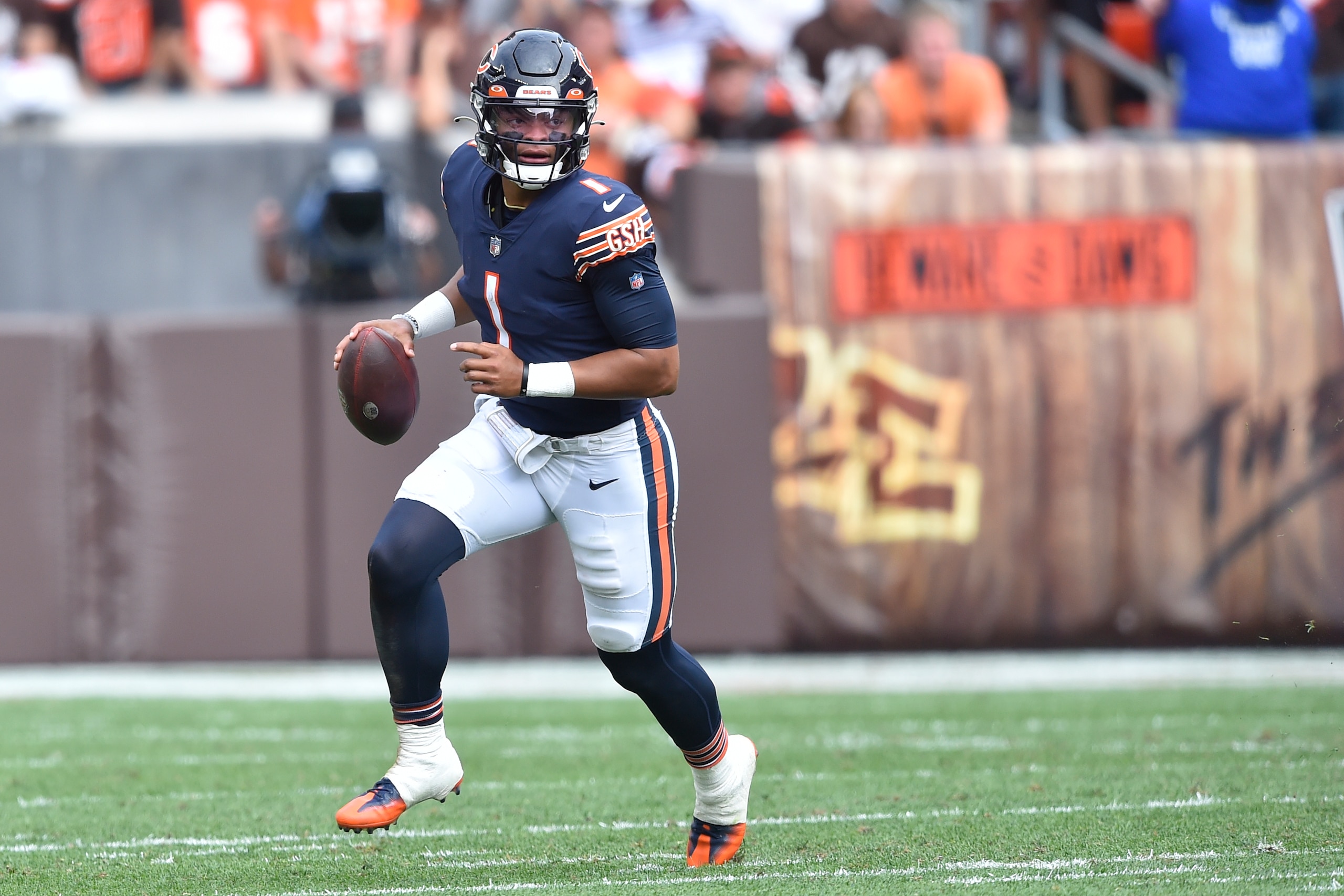 Chicago Bears quarterback Justin Fields runs with the ball during an NFL football game against the Cleveland Browns, Sunday, Sept. 26, 2021, in Cleveland. The Browns won 26-6. (AP Photo/David Richard)