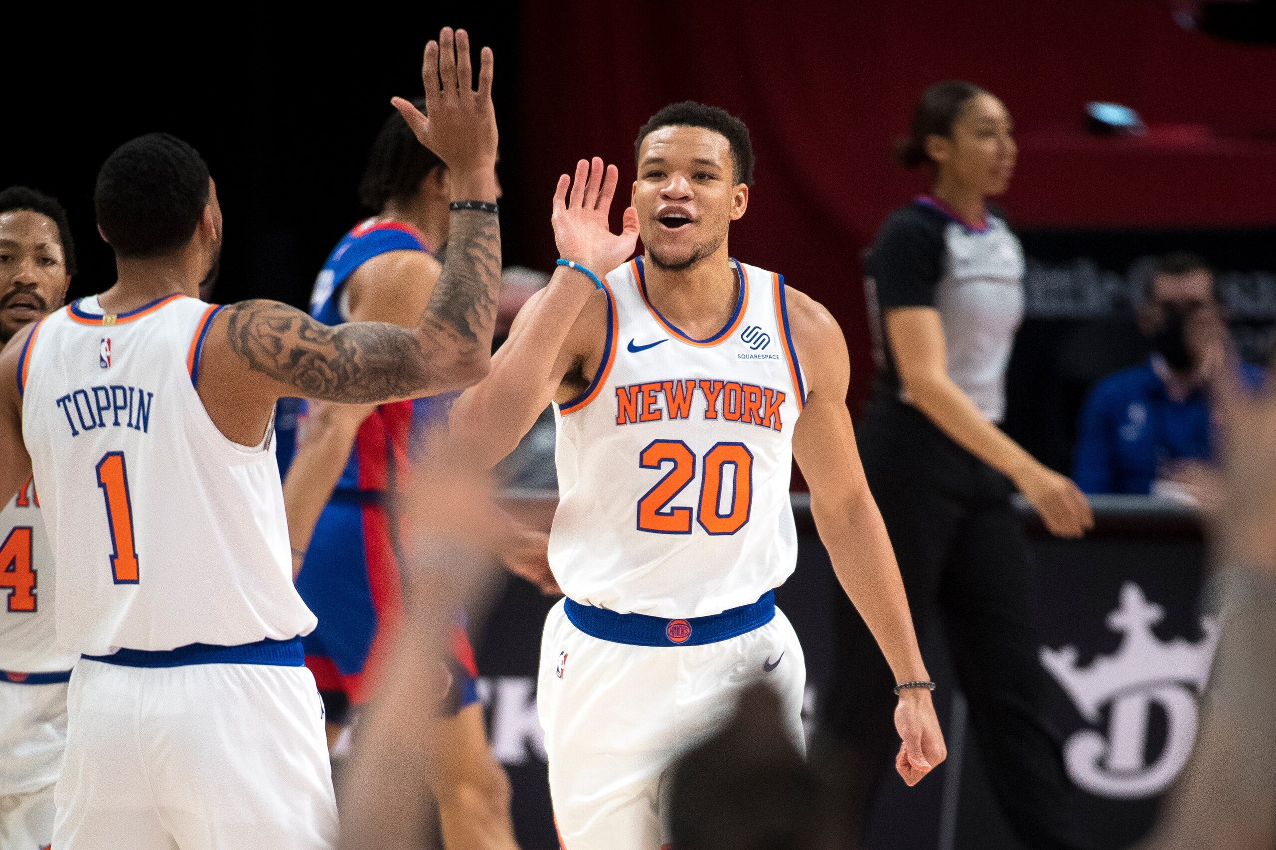 DETROIT, MICHIGAN - APRIL 03: Kevin Knox II #20 of the New York Knicks celebrates with Obi Toppin #1 during the fourth quarter of the game at Little Caesars Arena on April 03, 2021 in Detroit, Michigan. NOTE TO USER: User expressly acknowledges and agrees that, by downloading and or using this photograph, User is consenting to the terms and conditions of the Getty Images License Agreement. (Photo by Nic Antaya/Getty Images)