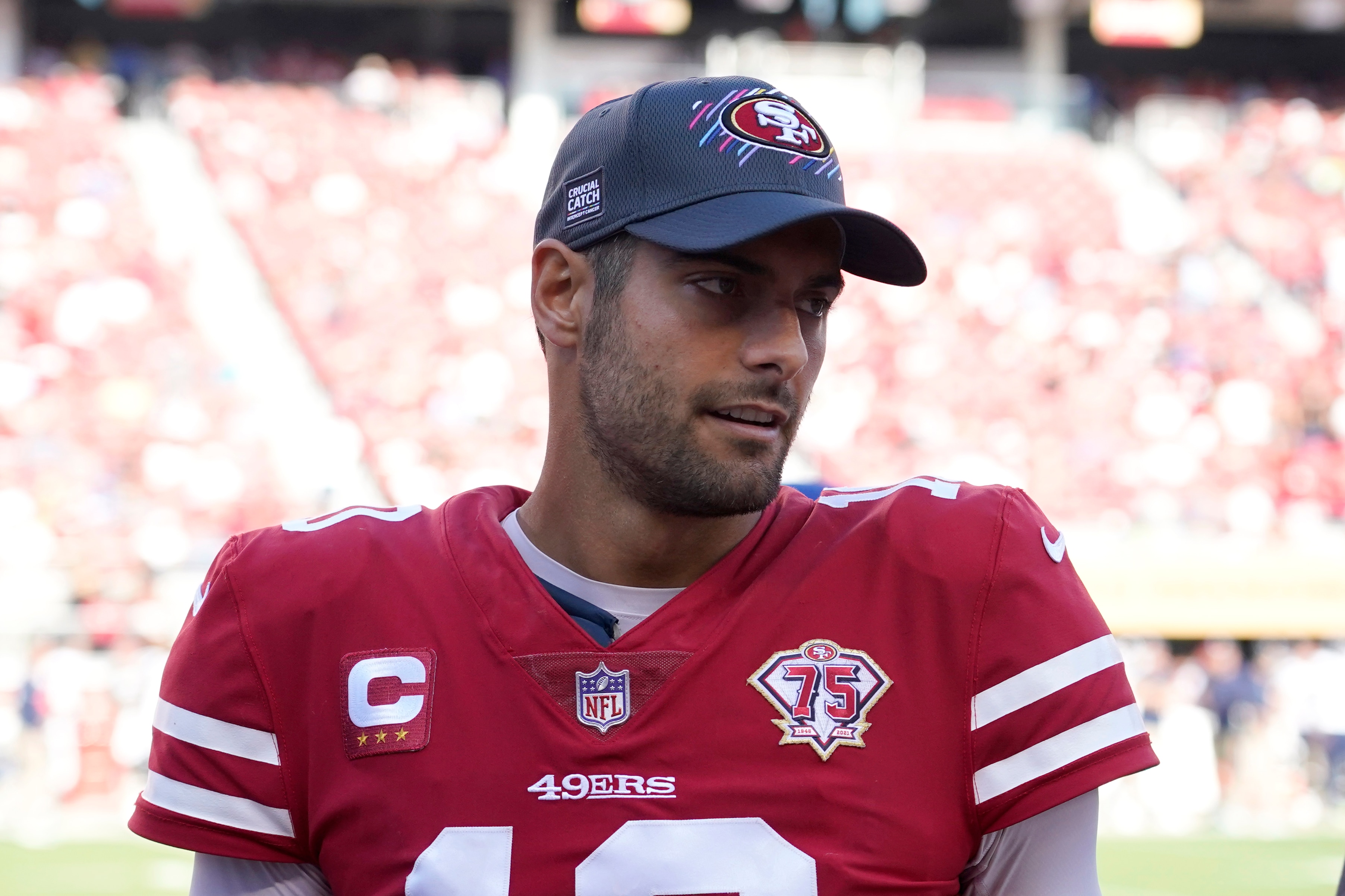 San Francisco 49ers quarterback Jimmy Garoppolo (10) stands on the sideline during the second half of an NFL football game against the Seattle Seahawks in Santa Clara, Calif., Sunday, Oct. 3, 2021. (AP Photo/Tony Avelar)