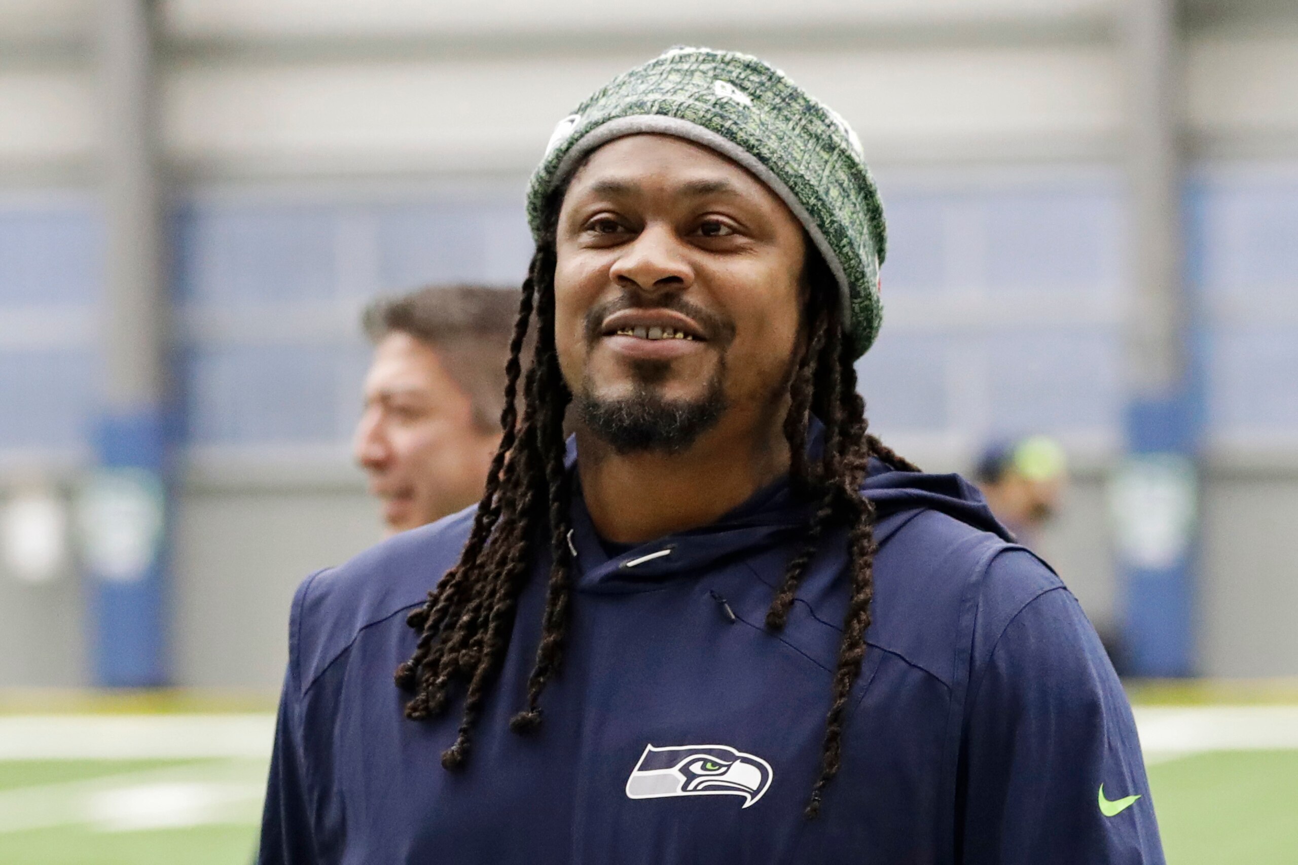 FILE - Seattle Seahawks running back Marshawn Lynch walks off the field after NFL football practice in Renton, Wash., in this Friday, Dec. 27, 2019, file photo. During Marshawn Lynch’s 12 NFL seasons he earned a reputation for his fearless style on the field, while remaining one of the league’s most reclusive figures off the field. Now the retired running back is lending his voice to try to help members of Black and Hispanic communities make more informed decisions about receiving COVID-19 vaccines. Lynch released a 30-minute interview with Dr. Anthony Fauci on his YouTube channel Friday, April 16, 2021, becoming the latest prominent athlete to sit down with him to discuss the efficacy of COVID-19 vaccines as the U.S. continues to combat the pandemic. (AP Photo/Ted S. Warren, File)