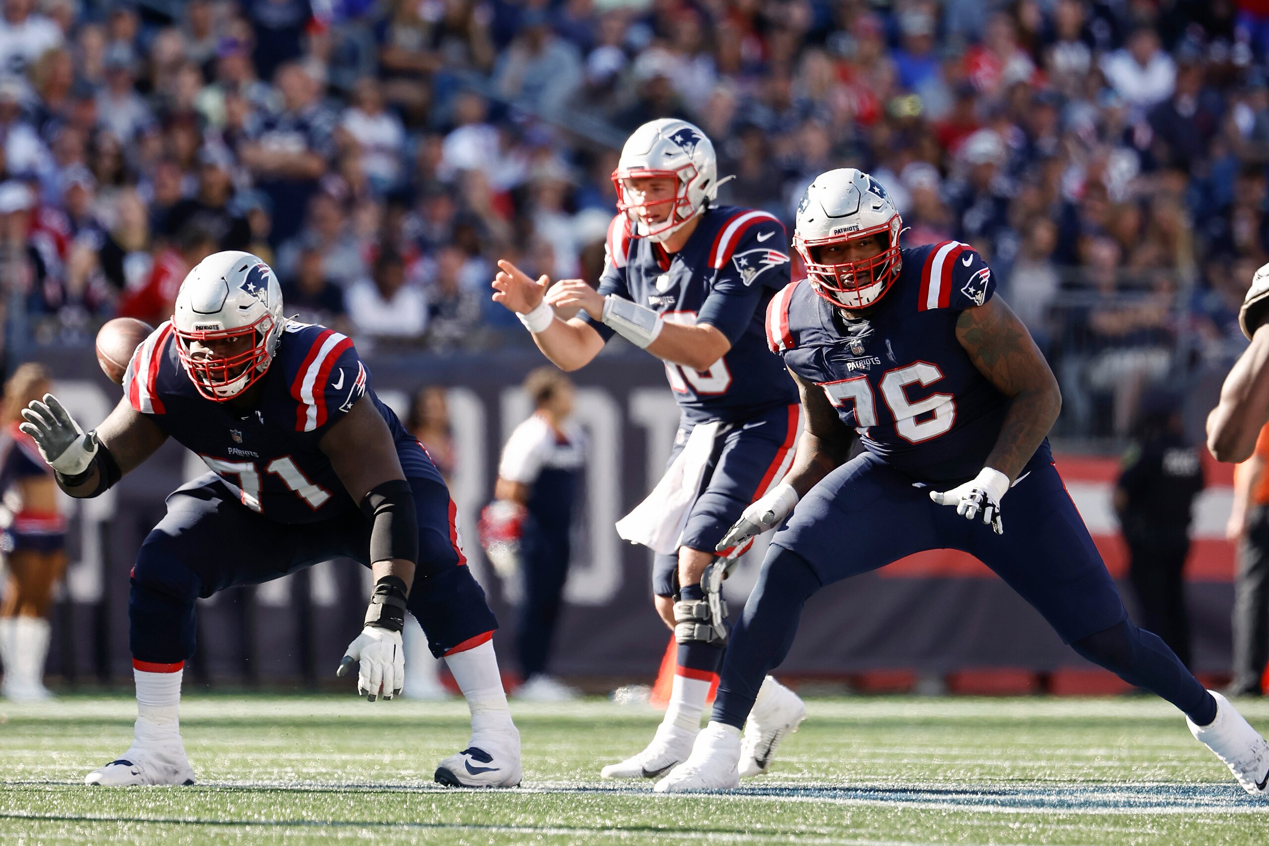 New England Patriots guard Mike Onwenu and offensive tackle Isaiah Wynn (76) prepare to block against the New Orleans Saints during an NFL football game at Gillette Stadium, Sunday,Sept. 26, 2021 in Foxborough, Mass. (Winslow Townson/AP Images for Panini) New England Patriots guard Mike Onwenu and offensive tackle Isaiah Wynn (76) prepare to block against the New Orleans Saints during an NFL football game at Gillette Stadium, Sunday,Sept. 26, 2021 in Foxborough, Mass. (Winslow Townson/AP Images for Panini)