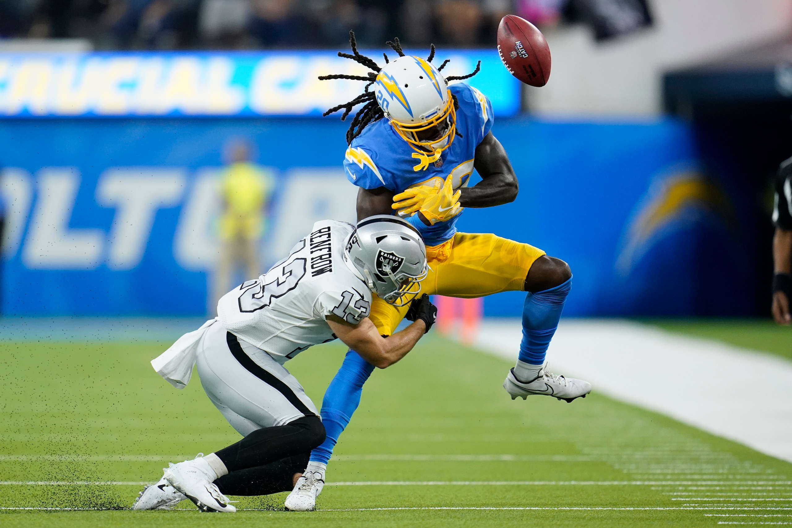 Los Angeles Chargers defensive back Tevaughn Campbell, right, can't make the catch on a fake punt as he is hit by Las Vegas Raiders wide receiver Hunter Renfrow during the first half of an NFL football game Monday, Oct. 4, 2021, in Inglewood, Calif. (AP Photo/Marcio Jose Sanchez) Los Angeles Chargers defensive back Tevaughn Campbell, right, can't make the catch on a fake punt as he is hit by Las Vegas Raiders wide receiver Hunter Renfrow during the first half of an NFL football game Monday, Oct. 4, 2021, in Inglewood, Calif. (AP Photo/Marcio Jose Sanchez)
