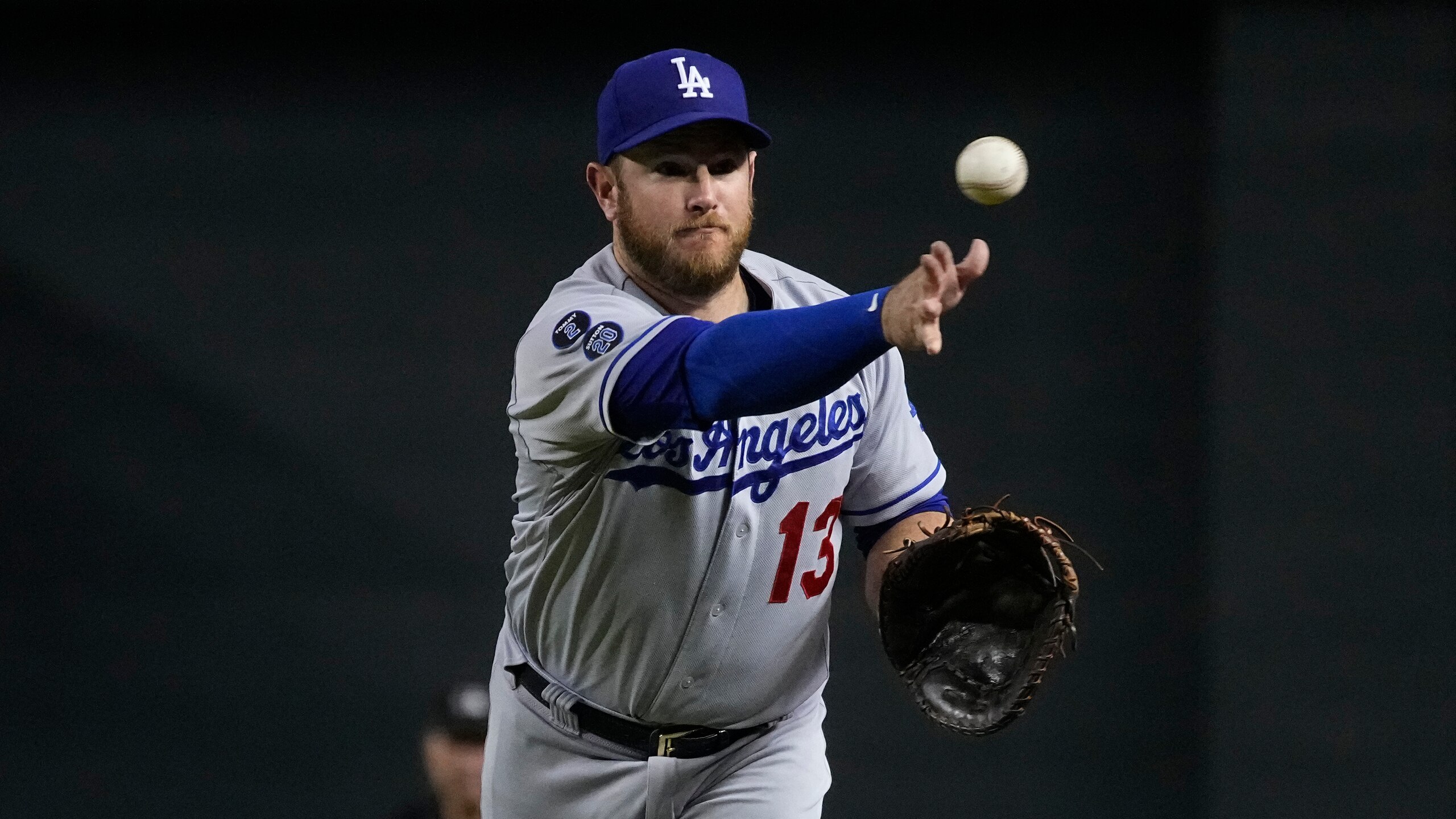 Los Angeles Dodgers first baseman Max Muncy (13) in the first inning during a baseball game against the Arizona Diamondbacks, Friday, Sept. 24, 2021, in Phoenix. (AP Photo/Rick Scuteri)