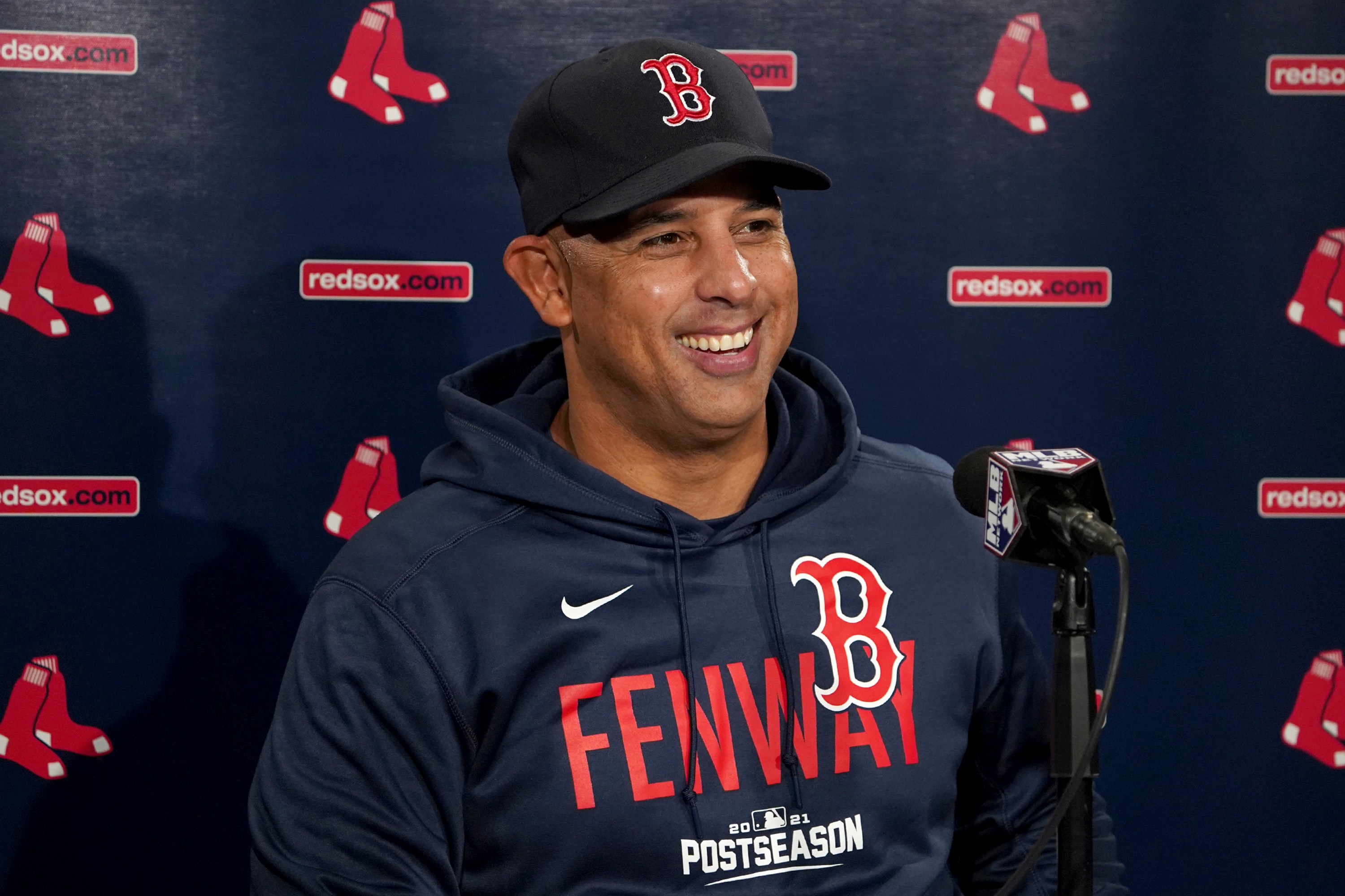 Boston Red Sox manager Alex Cora laughs during a news conference at the American League Wild Card Workout Day at Fenway Park, Monday, Oct. 4, 2021, before Tuesday's American League Wild Card game against the New York Yankees in Boston. (AP Photo/Mary Schwalm)