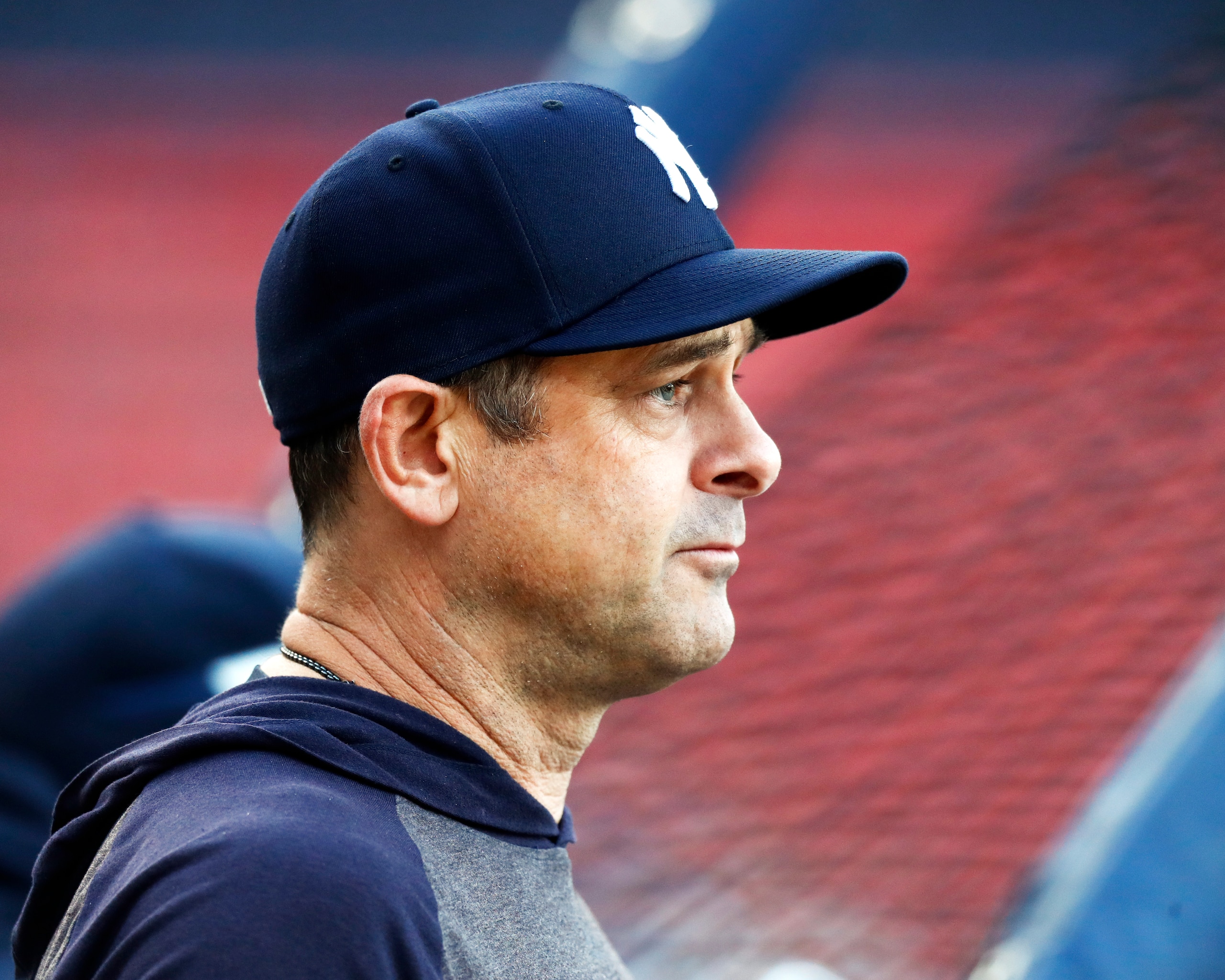 BOSTON, MASSACHUSETTS - SEPTEMBER 26: Manager Aaron Boone #17 of the New York Yankees looks on before the game between the Boston Red Sox and the New York Yankees at Fenway Park on September 26, 2021 in Boston, Massachusetts. (Photo by Omar Rawlings/Getty Images)