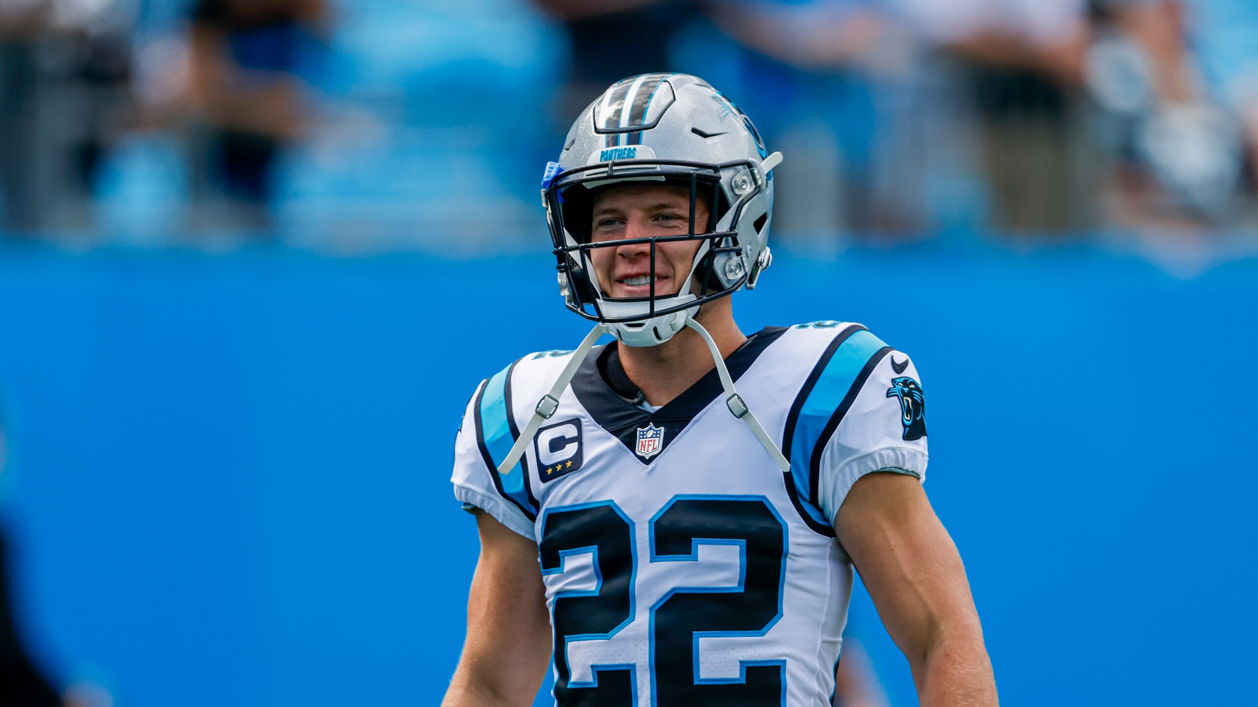 Carolina Panthers running back Christian McCaffrey walks onto the field before an NFL football game against the New Orleans Saints Sunday, Sept. 19, 2021, in Charlotte, N.C. (AP Photo/Nell Redmond)