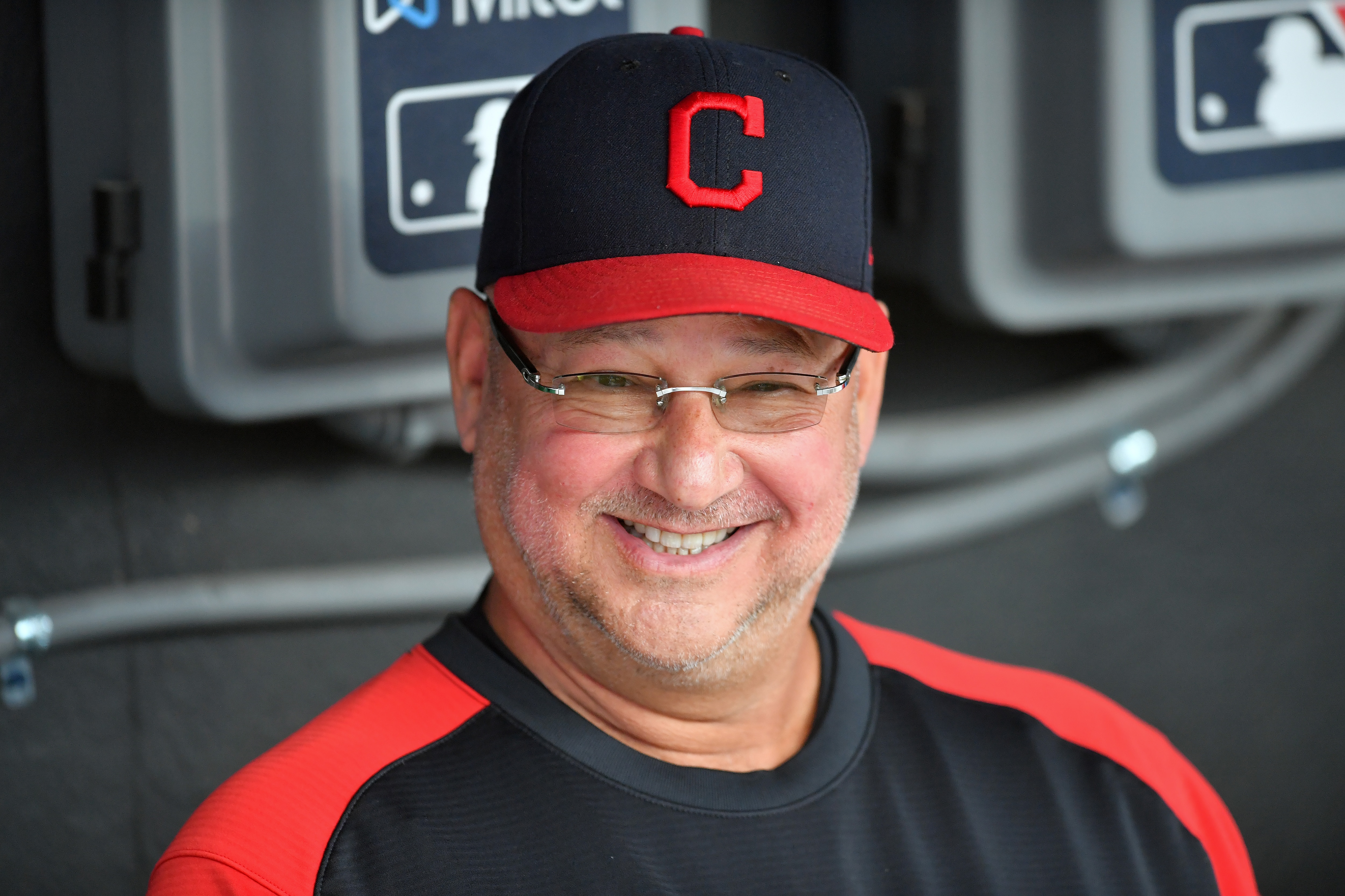 CLEVELAND, OHIO - JULY 22: Manager Terry Francona #77 of the Cleveland Indians jokes with teammates in the dugout prior to the game against the Tampa Bay Rays at Progressive Field on July 22, 2021 in Cleveland, Ohio. (Photo by Jason Miller/Getty Images)