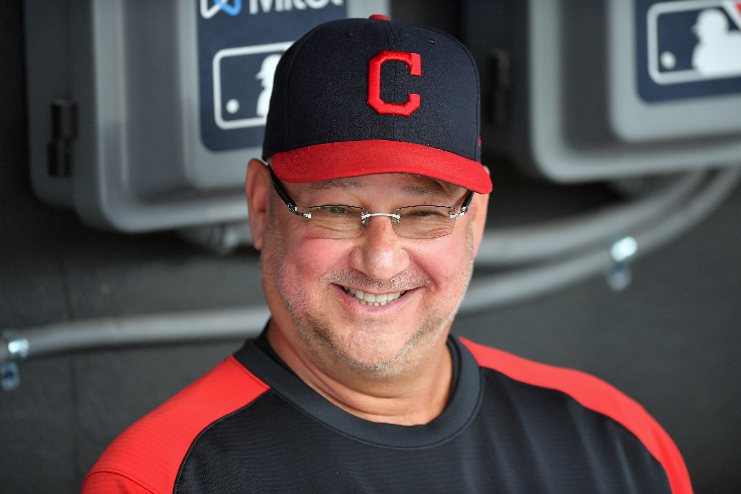 CLEVELAND, OHIO - JULY 22: Manager Terry Francona #77 of the Cleveland Indians jokes with teammates in the dugout prior to the game against the Tampa Bay Rays at Progressive Field on July 22, 2021 in Cleveland, Ohio. (Photo by Jason Miller/Getty Images)