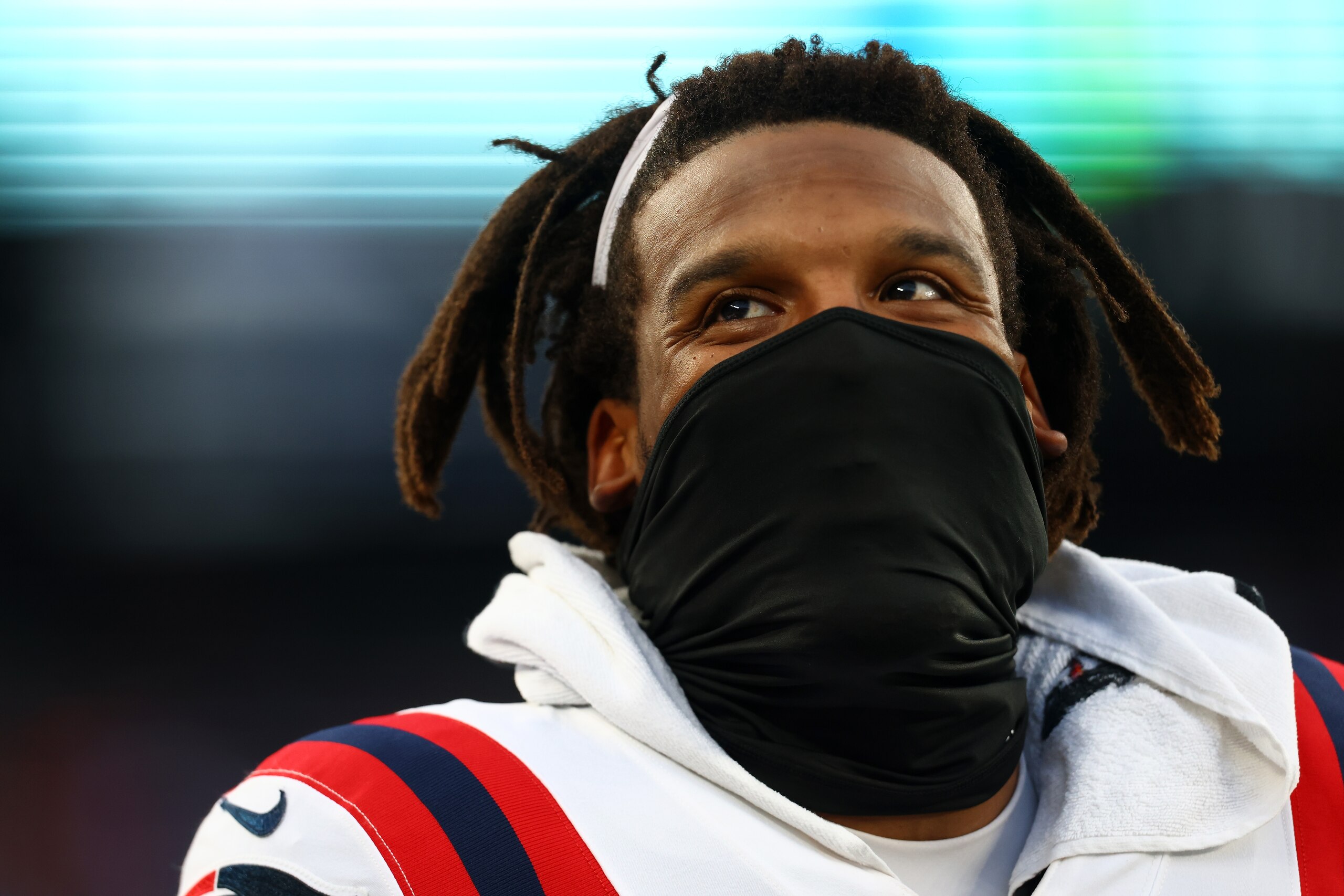 EAST RUTHERFORD, NEW JERSEY - AUGUST 29: Cam Newton #1 of the New England Patriots looks on from the bench during the game against the New York Giants at MetLife Stadium on August 29, 2021 in East Rutherford, New Jersey. (Photo by Mike Stobe/Getty Images)