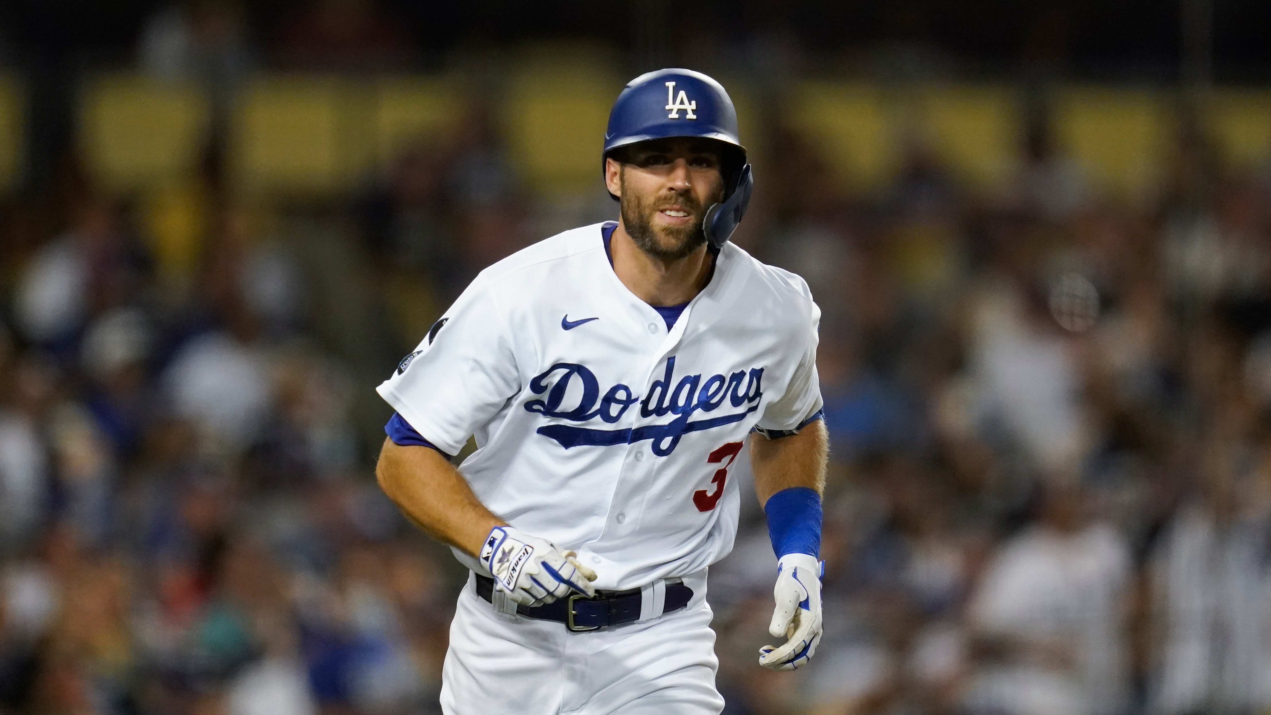 Los Angeles Dodgers Chris Taylor runs to first base during a baseball game against the San Diego Padres Friday, Sept. 10, 2021, in Los Angeles. (AP Photo/Ashley Landis)