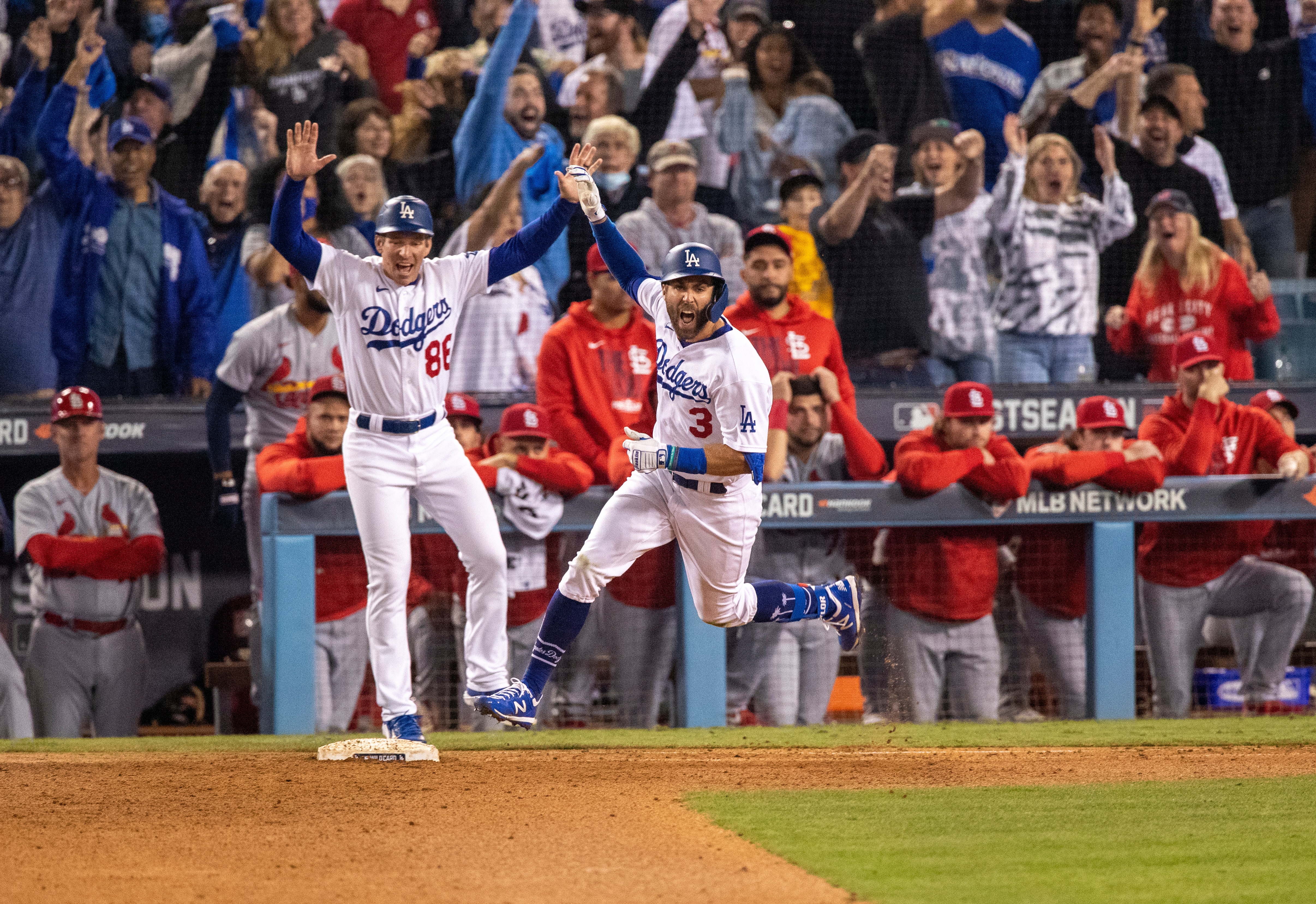 LOS ANGELES, CA - OCTOBER 6, 2021:  Los Angeles Dodgers left fielder Chris Taylor (3) reacts while running the bases after his 2-run homer wins the game against the St Louis Cardinals in the National League Wild Card game at Dodger Stadium on October 6, 2021 in Los Angeles, California.(Gina Ferazzi / Los Angeles Times via Getty Images)