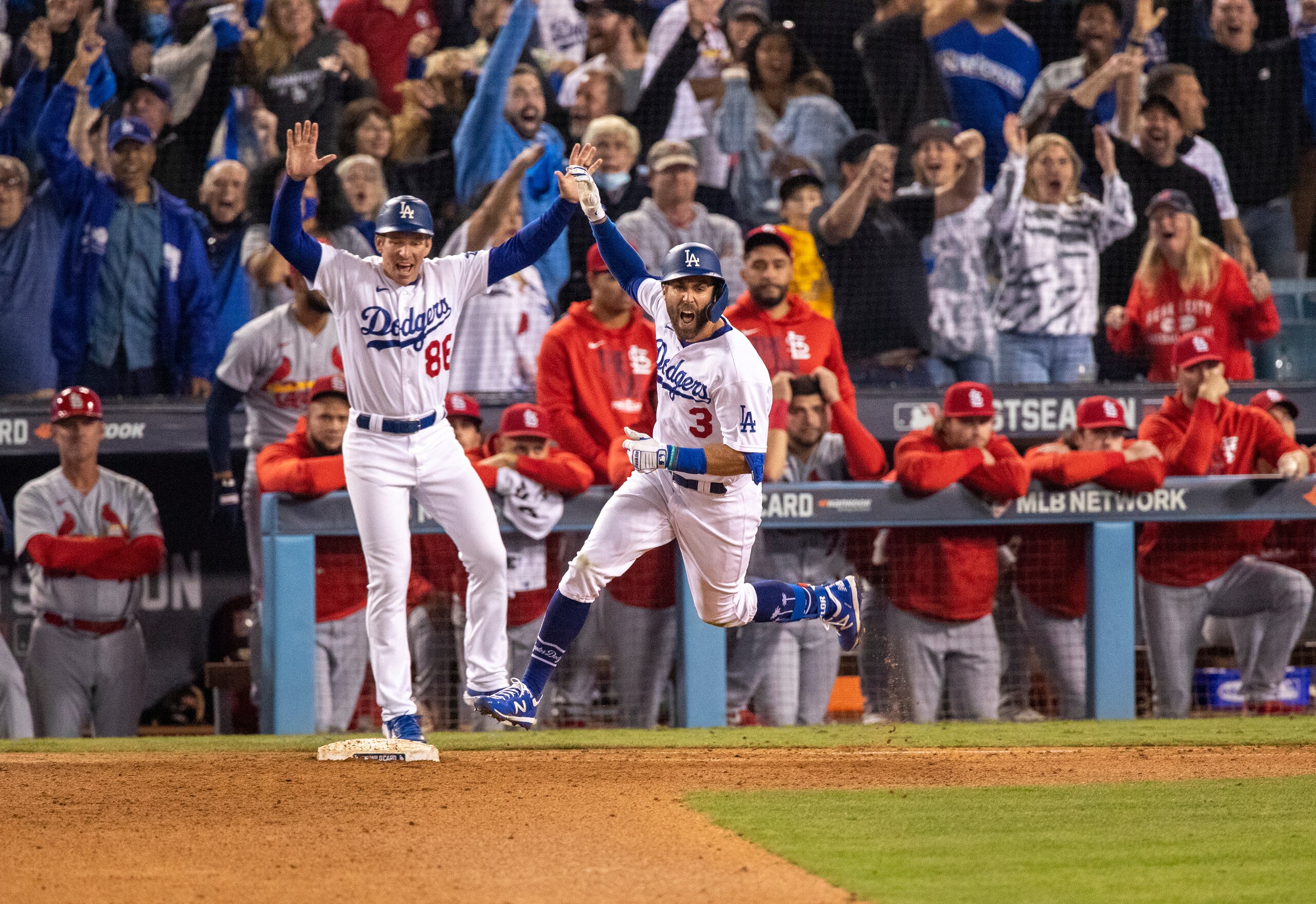 LOS ANGELES, CA - OCTOBER 6, 2021: Los Angeles Dodgers left fielder Chris Taylor (3) reacts while running the bases after his 2-run homer wins the game against the St Louis Cardinals in the National League Wild Card game at Dodger Stadium on October 6, 2021 in Los Angeles, California.(Gina Ferazzi / Los Angeles Times via Getty Images) LOS ANGELES, CA - OCTOBER 6, 2021: Los Angeles Dodgers left fielder Chris Taylor (3) reacts while running the bases after his 2-run homer wins the game against the St Louis Cardinals in the National League Wild Card game at Dodger Stadium on October 6, 2021 in Los Angeles, California.(Gina Ferazzi / Los Angeles Times via Getty Images)