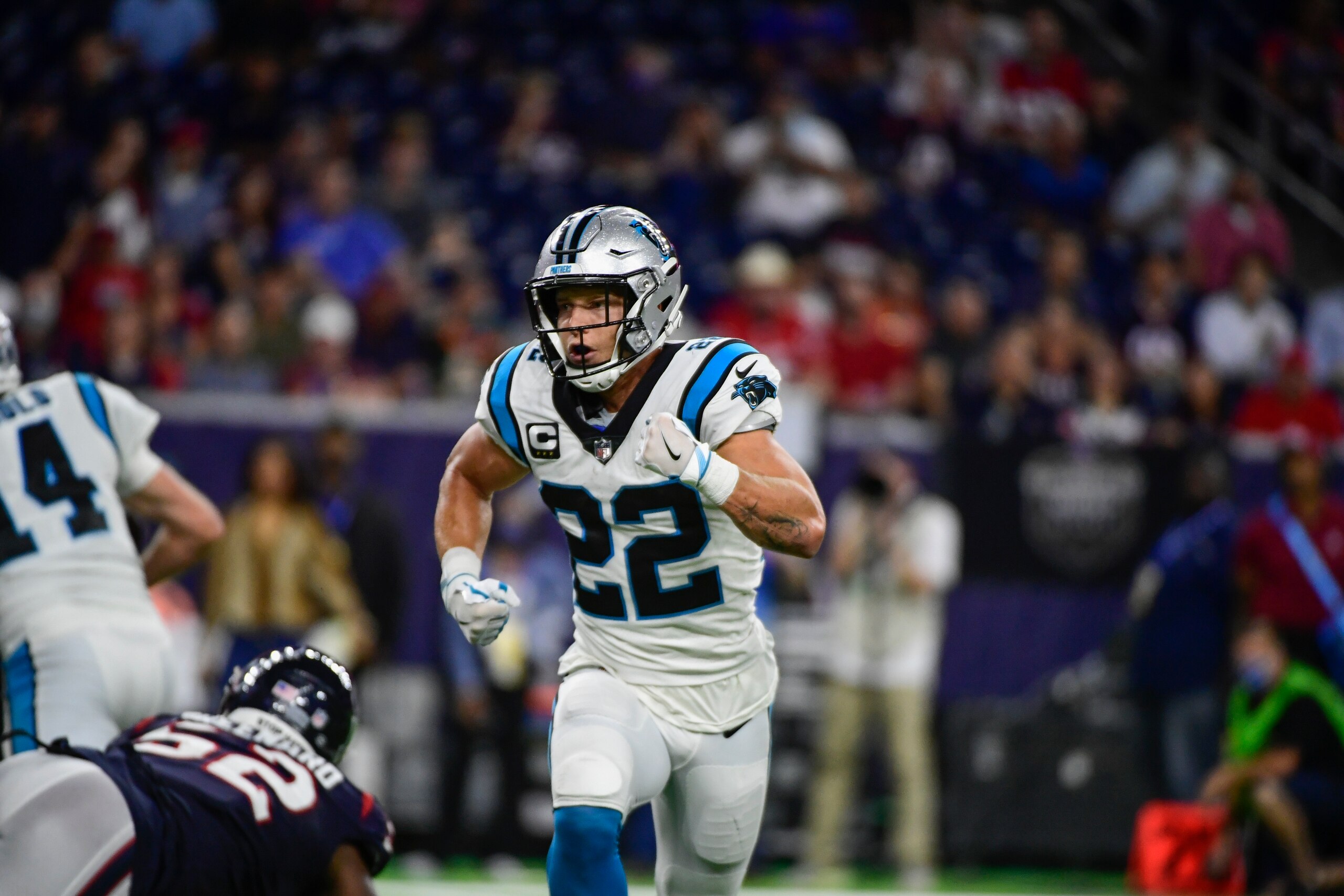 Carolina Panthers running back Christian McCaffrey (22) runs for the sidelines on a hand off fake against the Houston Texans during the first half of an NFL football game Thursday, Sept. 23, 2021, in Houston. (AP Photo/Justin Rex)