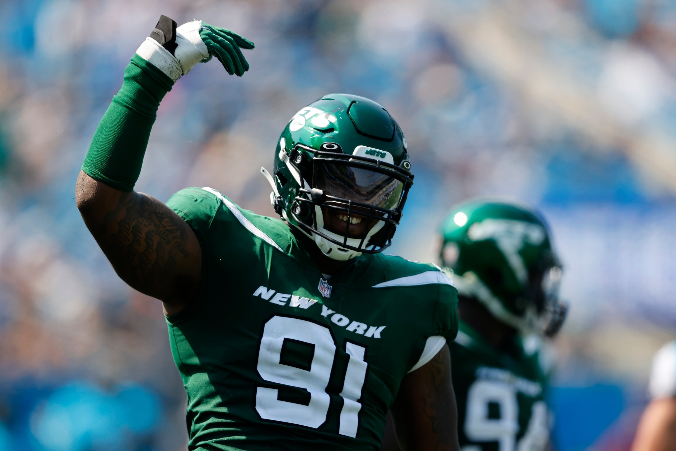 New York Jets defensive end John Franklin-Myers celebrates during the second half of an NFL football game against the Carolina Panthers Sunday, Sept. 12, 2021, in Charlotte, N.C. (AP Photo/Nell Redmond)