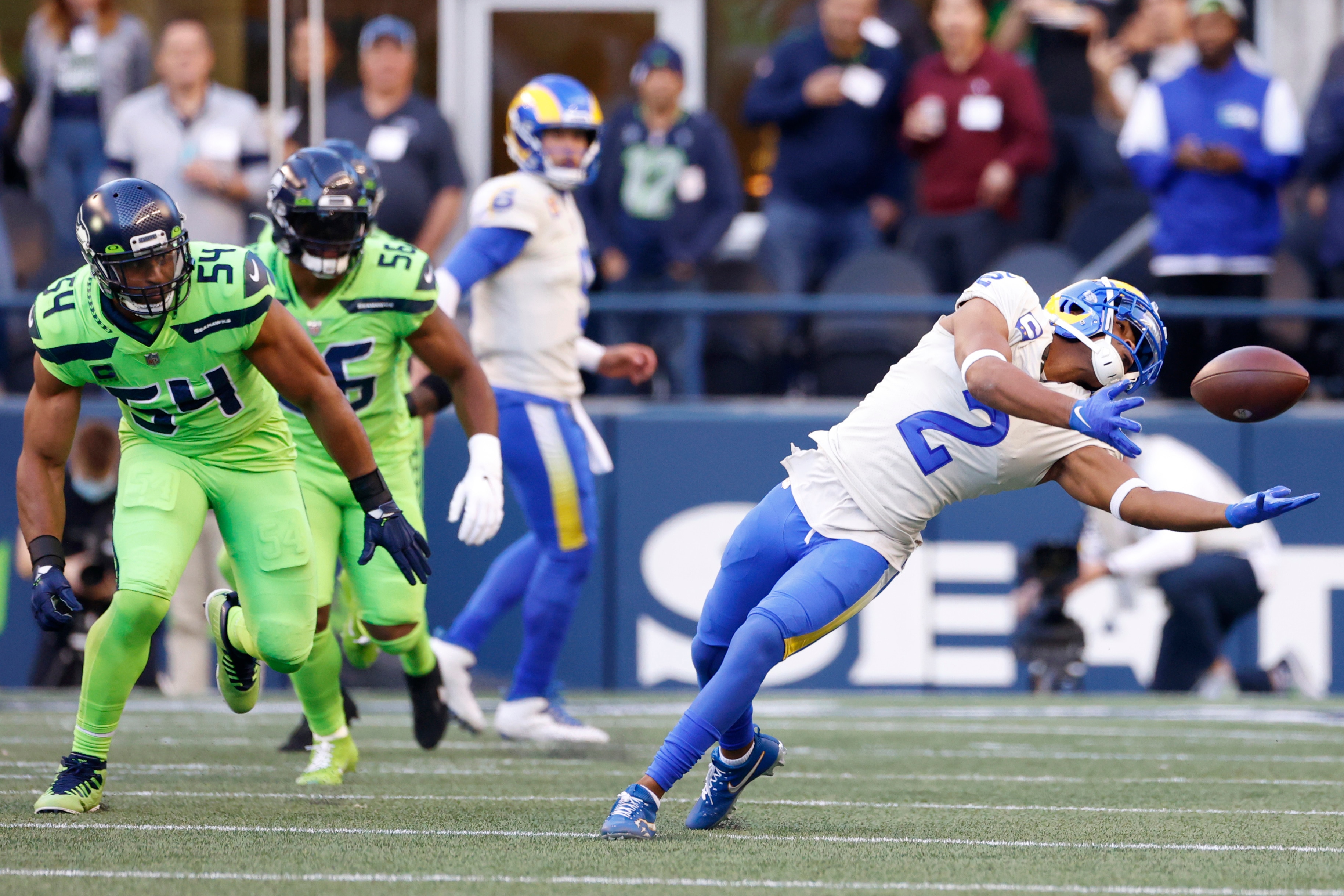 Los Angeles Rams wide receiver Robert Woods (2) makes a catch as Seattle Seahawks middle linebacker Bobby Wagner (54) looks on during the first half of an NFL football game, Thursday, Oct. 7, 2021, in Seattle. (AP Photo/Craig Mitchelldyer)