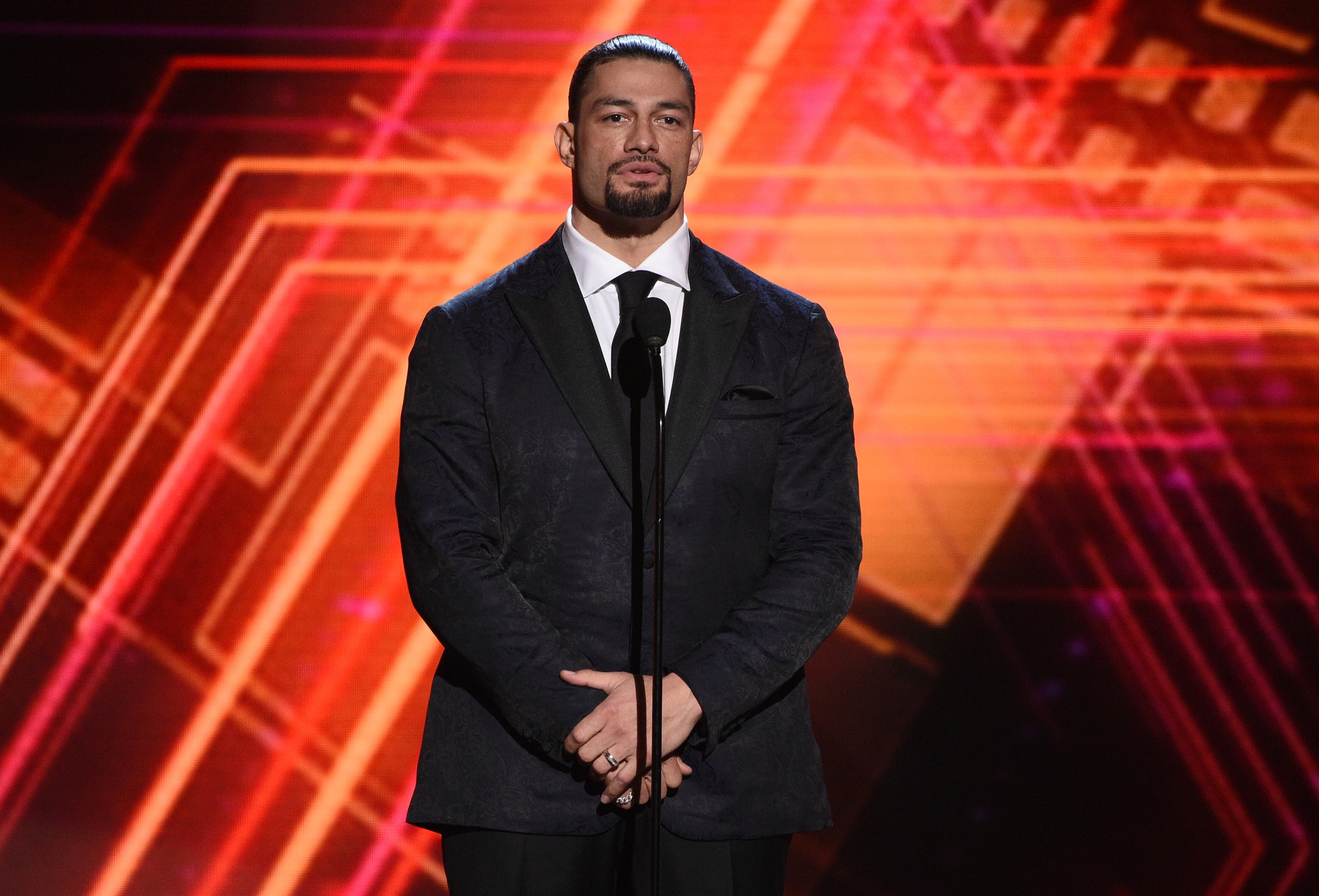 Roman Reigns presents the best coach award at the ESPY Awards on Wednesday, July 10, 2019, at the Microsoft Theater in Los Angeles. (Photo by Chris Pizzello/Invision/AP)