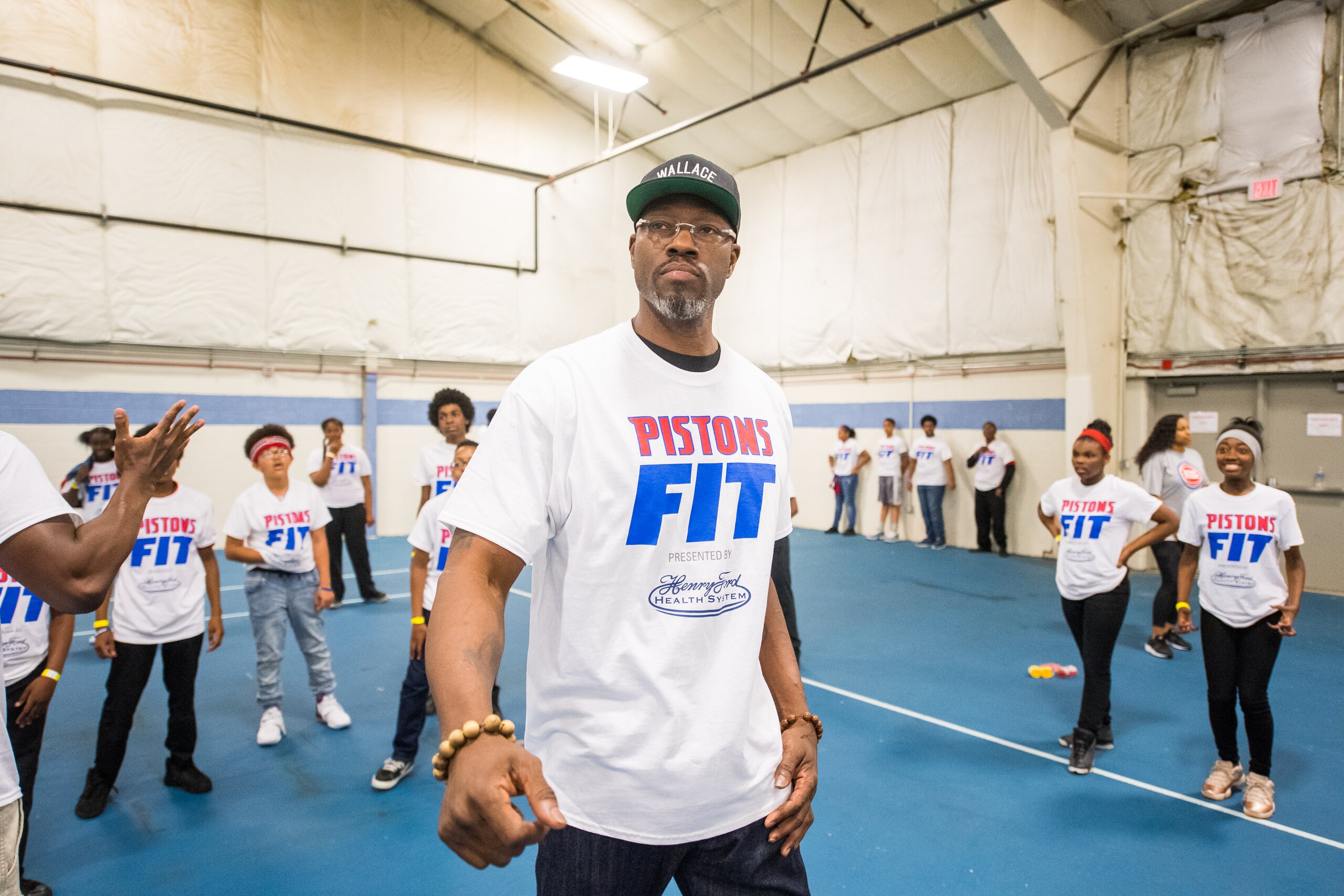 REDFORD, MI - JUNE 1: Detroit Pistons legend Ben Wallace lead students in fitness activities and celebrate the schools victory in a ten-week competition for highest fitness activity level on June 1, 2018 at Redford Service Learning Academy in Redford, Michigan.  NOTE TO USER: User expressly acknowledges and agrees that, by downloading and or using this photograph, User is consenting to the terms and conditions of the Getty Images License Agreement. Mandatory Copyright Notice: Copyright 2018 NBAE (Photo by Chris Schwegler/NBAE via Getty Images)