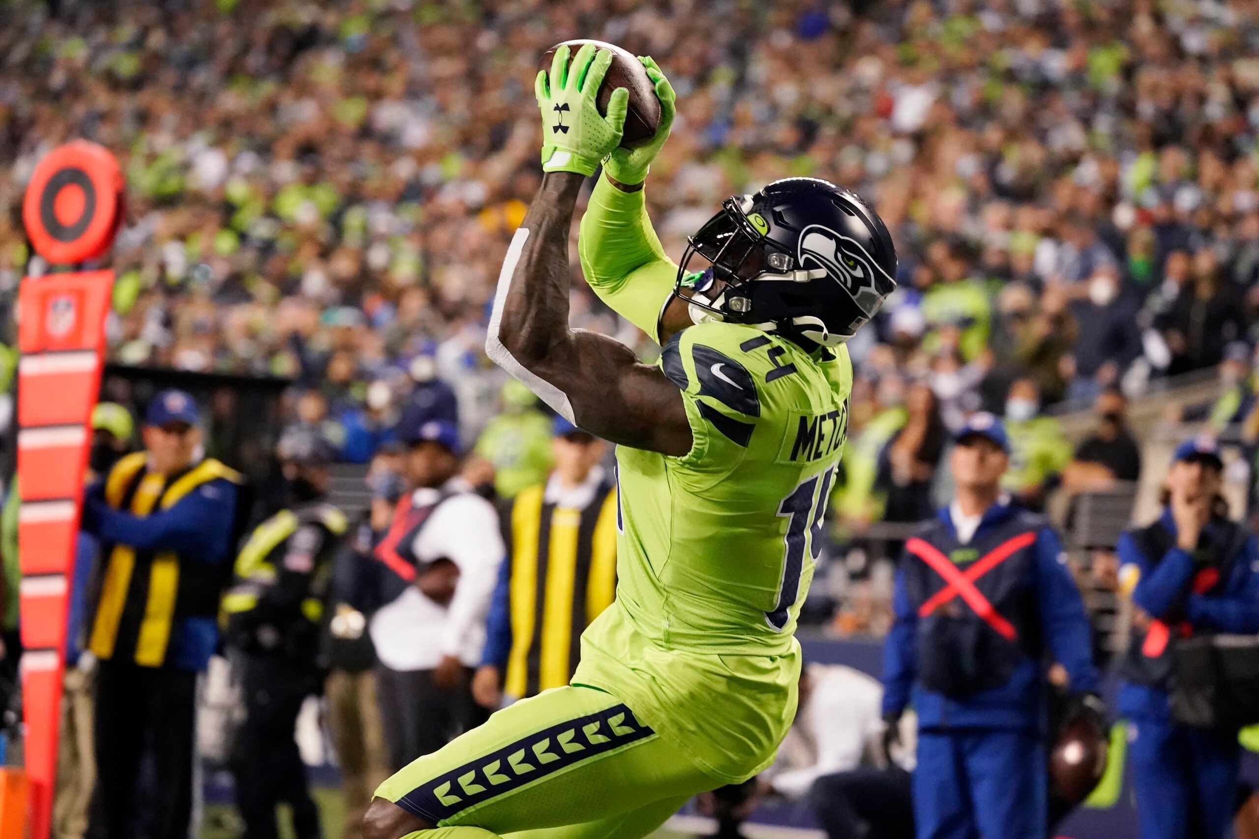 Seattle Seahawks wide receiver DK Metcalf catches a pass from backup quarterback Geno Smith for a touchdown against the Los Angeles Rams during the second half of an NFL football game, Thursday, Oct. 7, 2021, in Seattle. (AP Photo/Elaine Thompson) Seattle Seahawks wide receiver DK Metcalf catches a pass from backup quarterback Geno Smith for a touchdown against the Los Angeles Rams during the second half of an NFL football game, Thursday, Oct. 7, 2021, in Seattle. (AP Photo/Elaine Thompson)