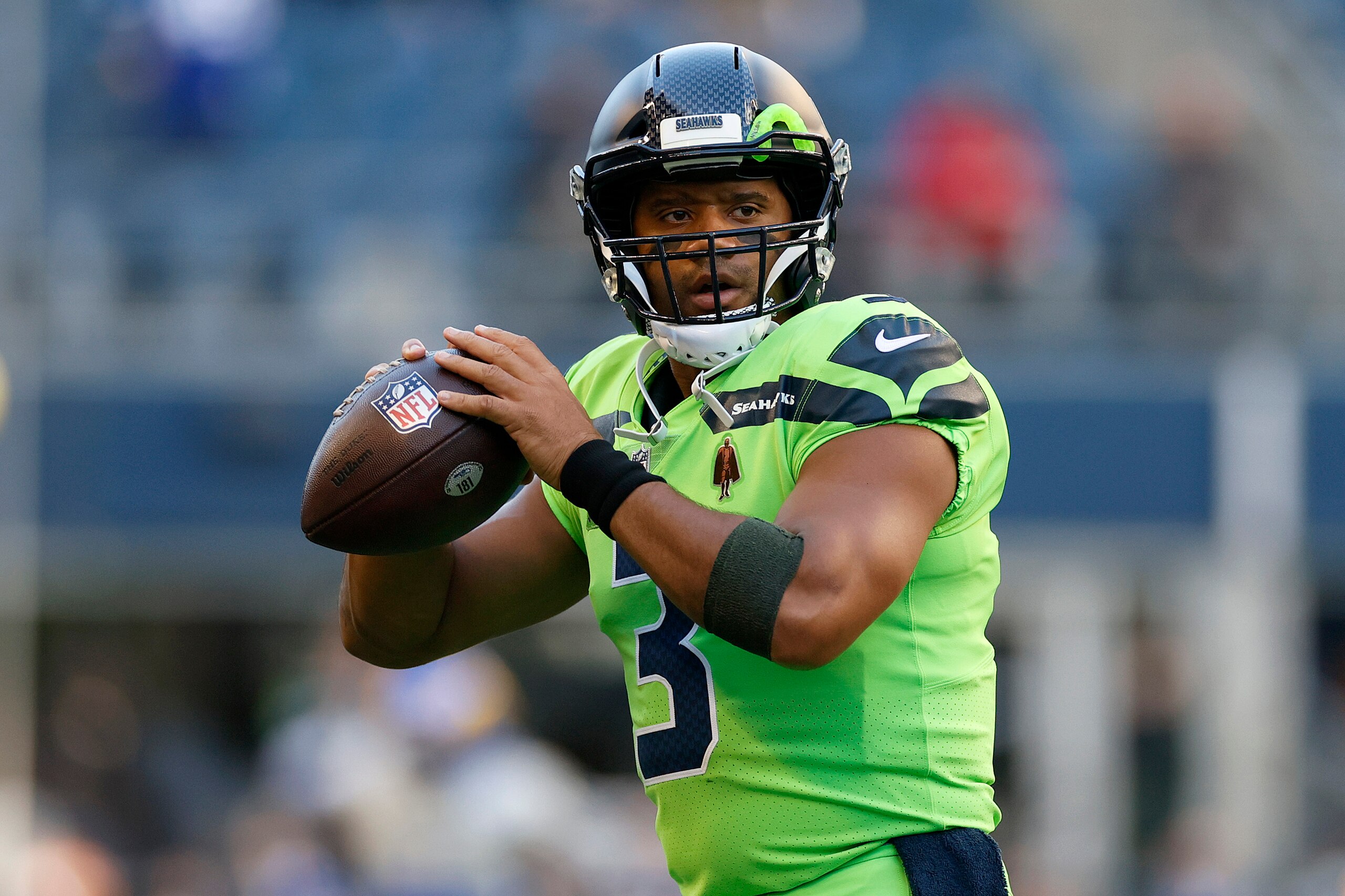 SEATTLE, WASHINGTON - OCTOBER 07: Russell Wilson #3 of the Seattle Seahawks warms up before the game against the Los Angeles Rams at Lumen Field on October 07, 2021 in Seattle, Washington. (Photo by Steph Chambers/Getty Images)