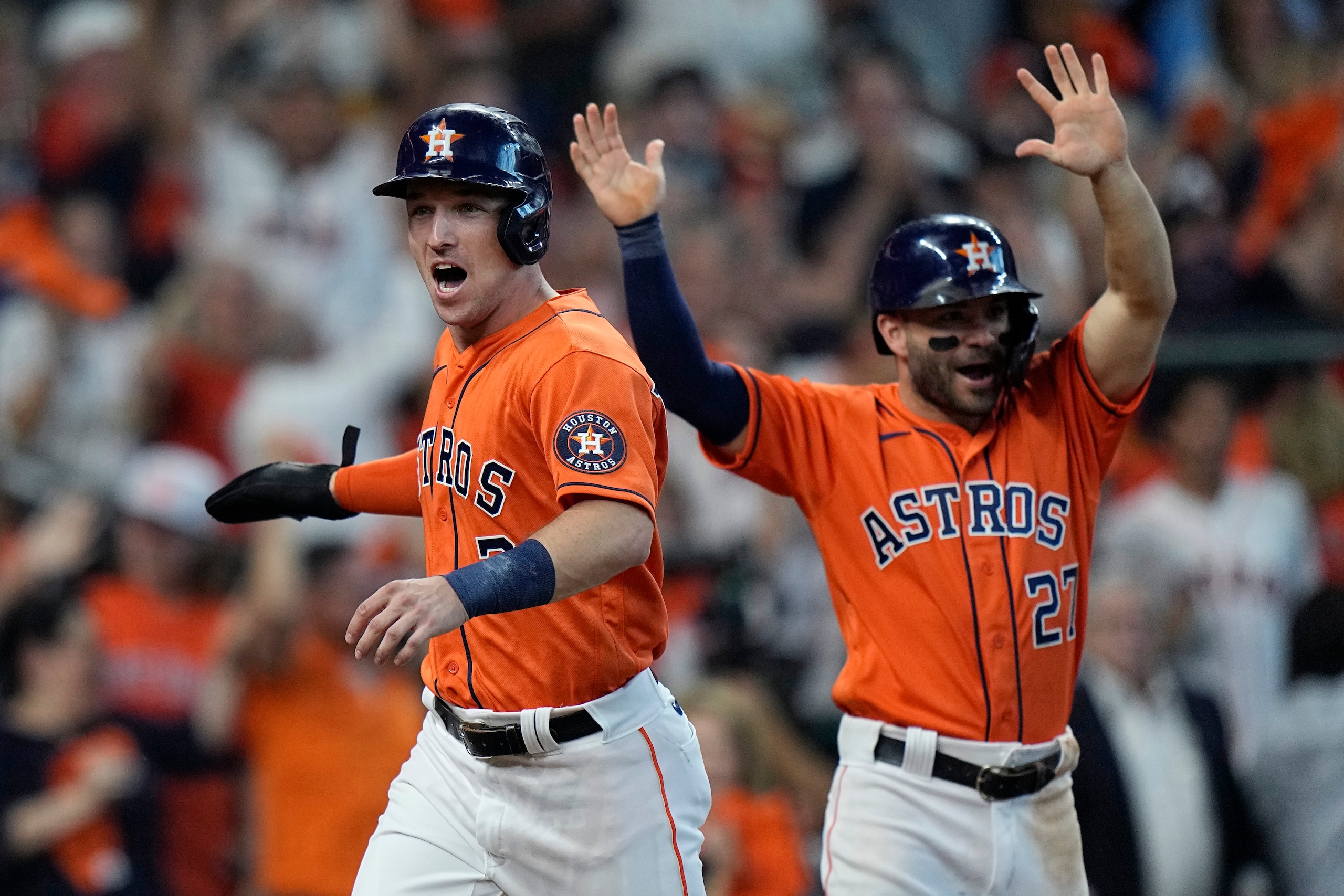 Houston Astros' Alex Bregman (2) and Jose Altuve (27) celebrate as they score on teammate Yuli Gurriel's single during the fifth inning in Game 2 of a baseball American League Division Series against the Chicago White Sox,Friday, Oct. 8, 2021, in Houston. (AP Photo/David J. Phillip) Houston Astros' Alex Bregman (2) and Jose Altuve (27) celebrate as they score on teammate Yuli Gurriel's single during the fifth inning in Game 2 of a baseball American League Division Series against the Chicago White Sox,Friday, Oct. 8, 2021, in Houston. (AP Photo/David J. Phillip)
