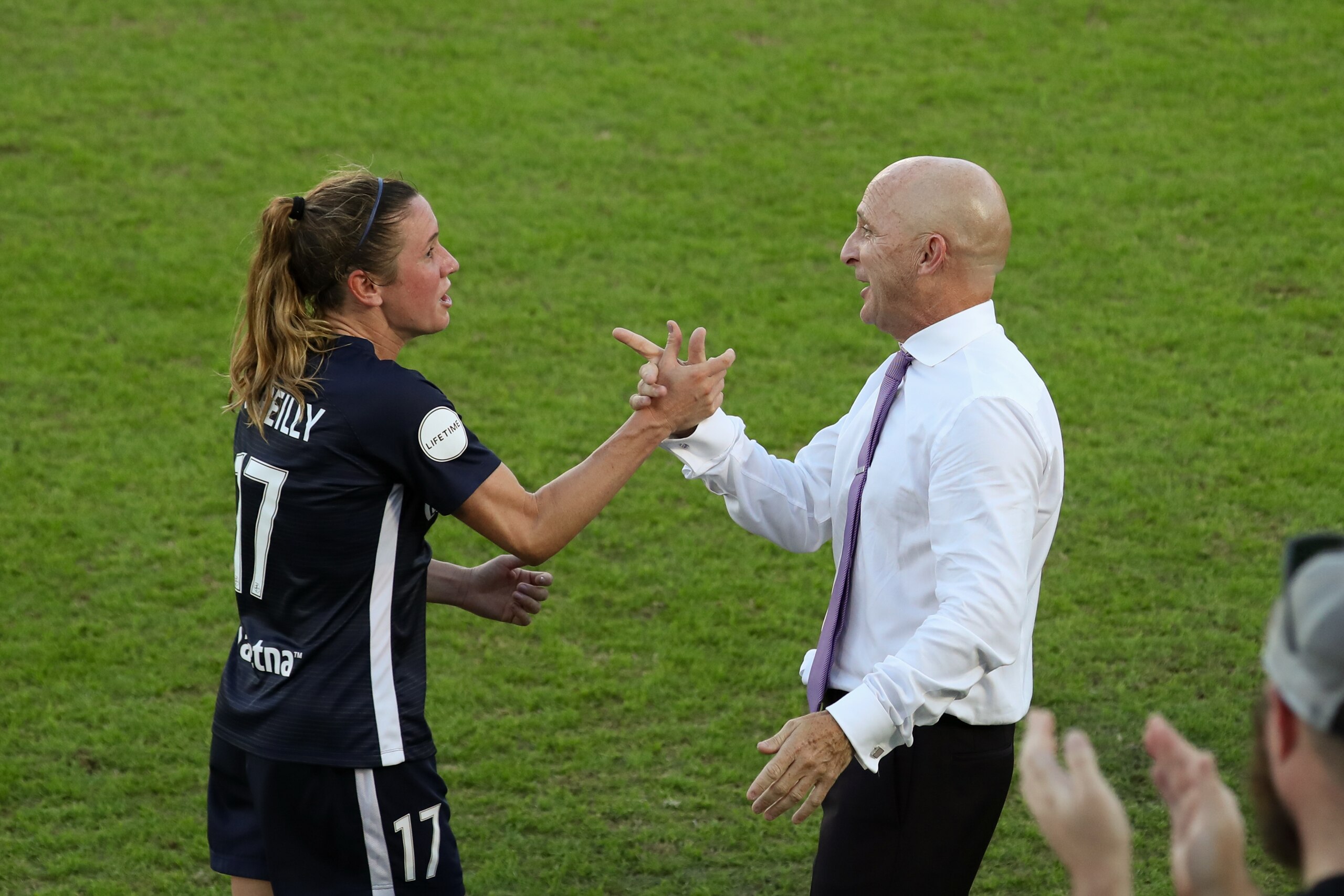CARY, NC - OCTOBER 27: Heather O'Reilly #17 of the North Carolina Courage celebrates with head coach Paul Riley after being subbed out ending her career during a game between Chicago Red Stars and North Carolina Courage at Sahlen's Stadium at WakeMed Soccer Park on October 27, 2019 in Cary, North Carolina. The North Carolina Courage defeated the Chicago Red Stars 4-0 to win the 2019 NWSL Championship. (Photo by Andy Mead/ISI Photos/Getty Images).