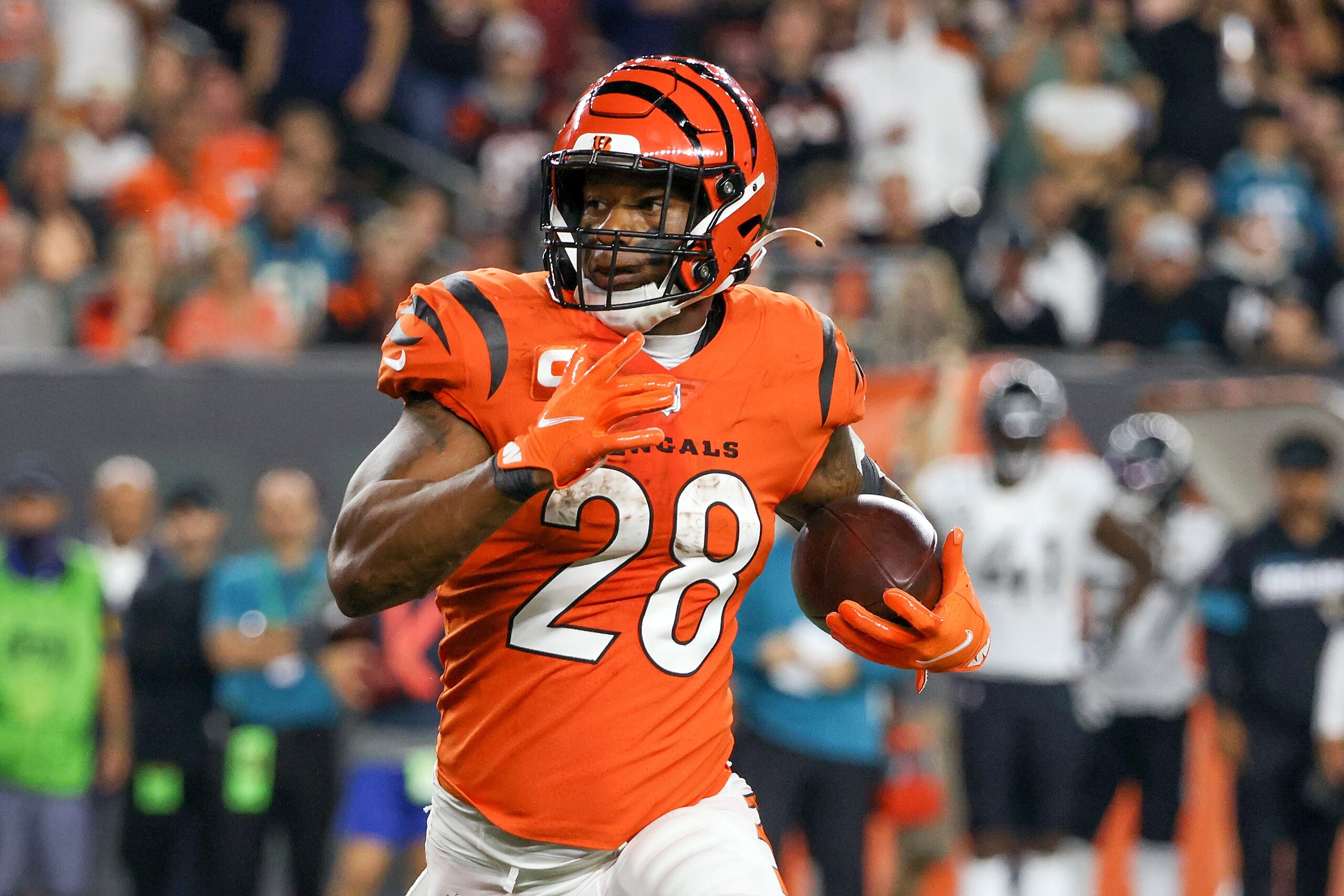 CINCINNATI, OHIO - SEPTEMBER 30: Joe Mixon #28 of the Cincinnati Bengals runs with the ball in the third quarter against the Jacksonville Jaguars at Paul Brown Stadium on September 30, 2021 in Cincinnati, Ohio. (Photo by Dylan Buell/Getty Images)