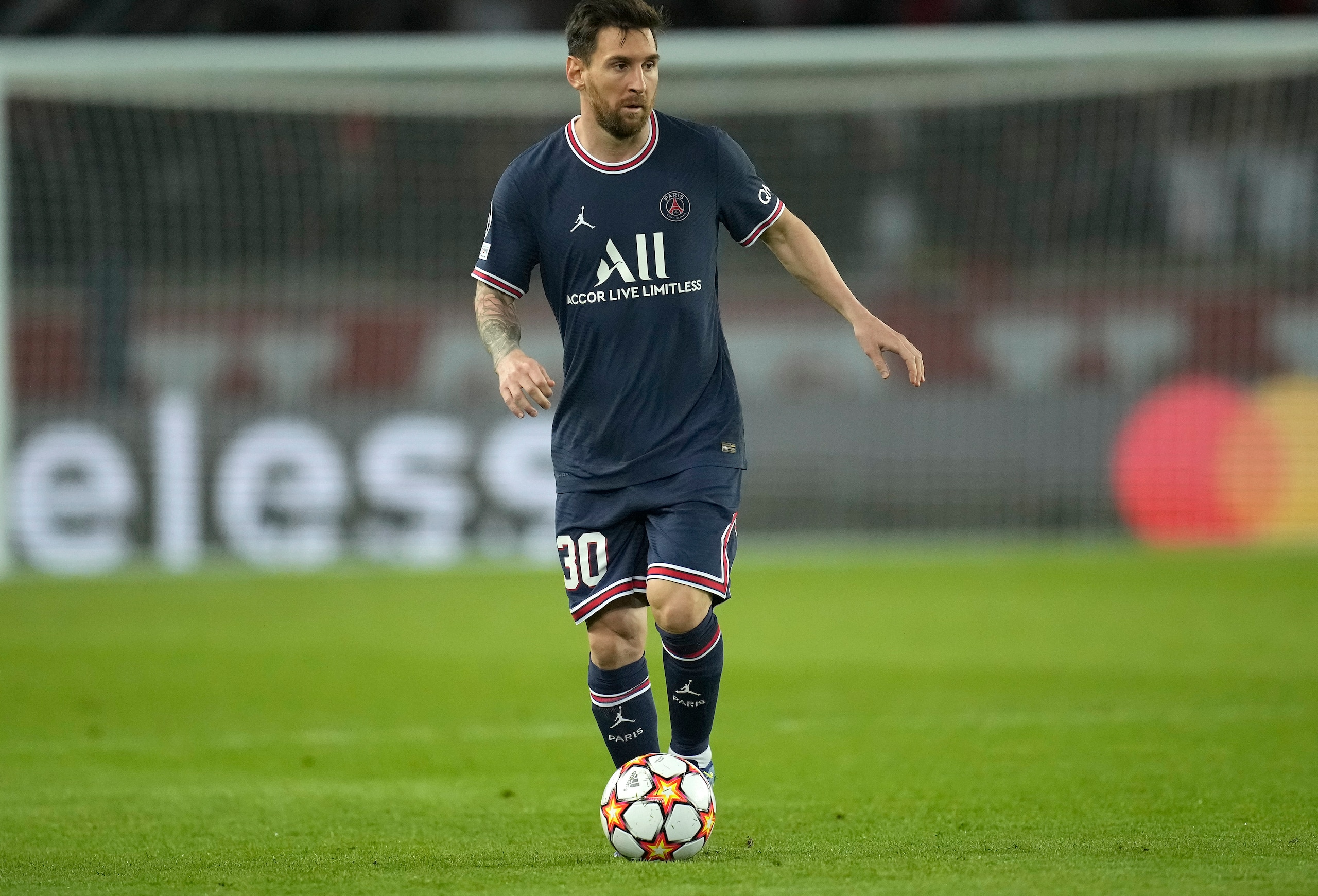 PSG's Lionel Messi runs with the ball during the Champions League Group A soccer match between Paris Saint-Germain and Manchester City at the Parc des Princes in Paris, Tuesday, Sept. 28, 2021. (AP Photo/Christophe Ena) PSG's Lionel Messi runs with the ball during the Champions League Group A soccer match between Paris Saint-Germain and Manchester City at the Parc des Princes in Paris, Tuesday, Sept. 28, 2021. (AP Photo/Christophe Ena)