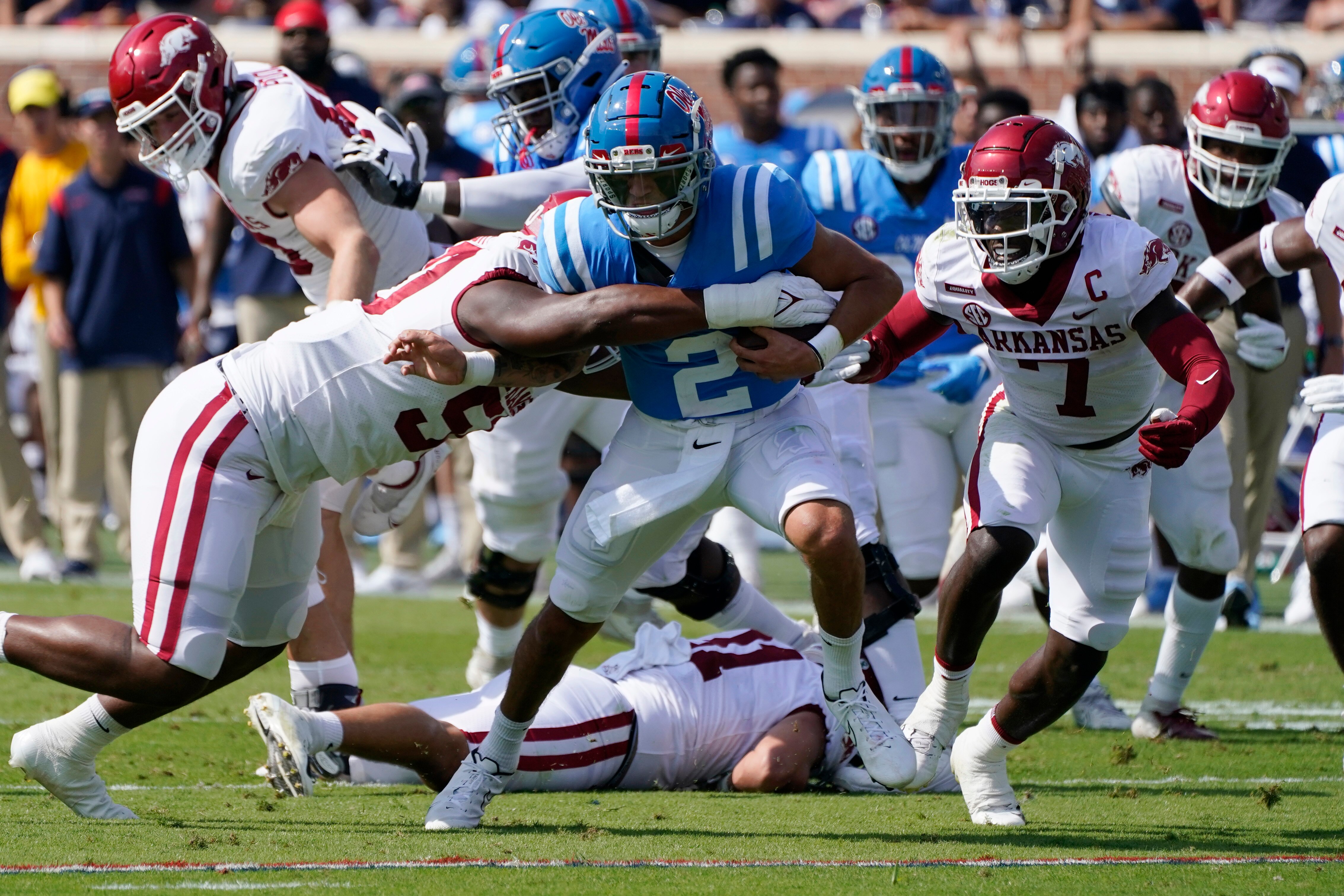 Mississippi quarterback Matt Corral (2) runs for a first down during the first half of an NCAA college football game against Arkansas, Saturday, Oct. 9, 2021, in Oxford, Miss. (AP Photo/Rogelio V. Solis)