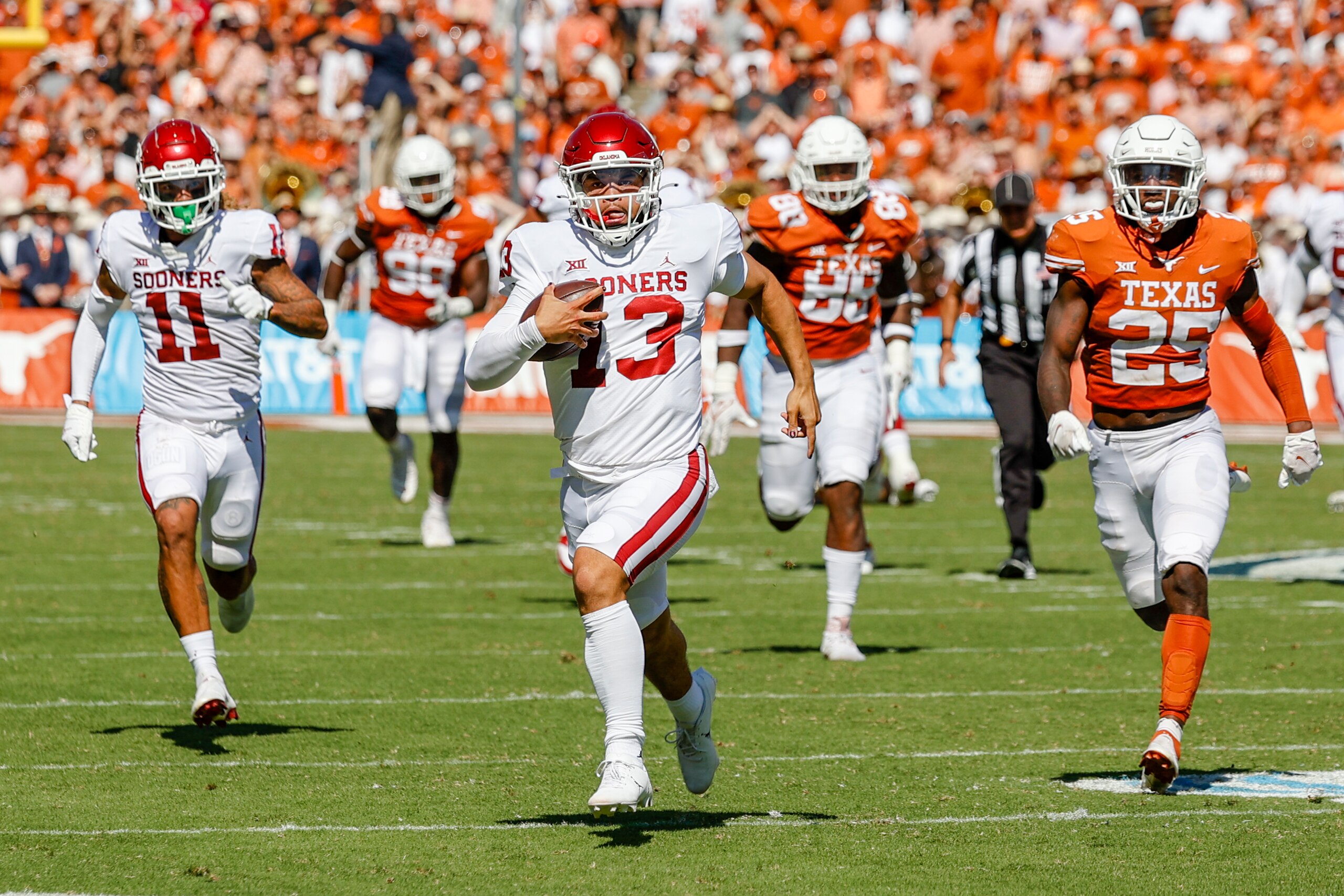 DALLAS, TX - OCTOBER 09: Oklahoma Sooners quarterback Caleb Williams (13) runs for a touchdown during the Red River Showdown between the Texas Longhorns and the Oklahoma Sooners on October 09, 2021 at the Cotton Bowl in Dallas, Texas. (Photo by Matthew Pearce/Icon Sportswire via Getty Images)