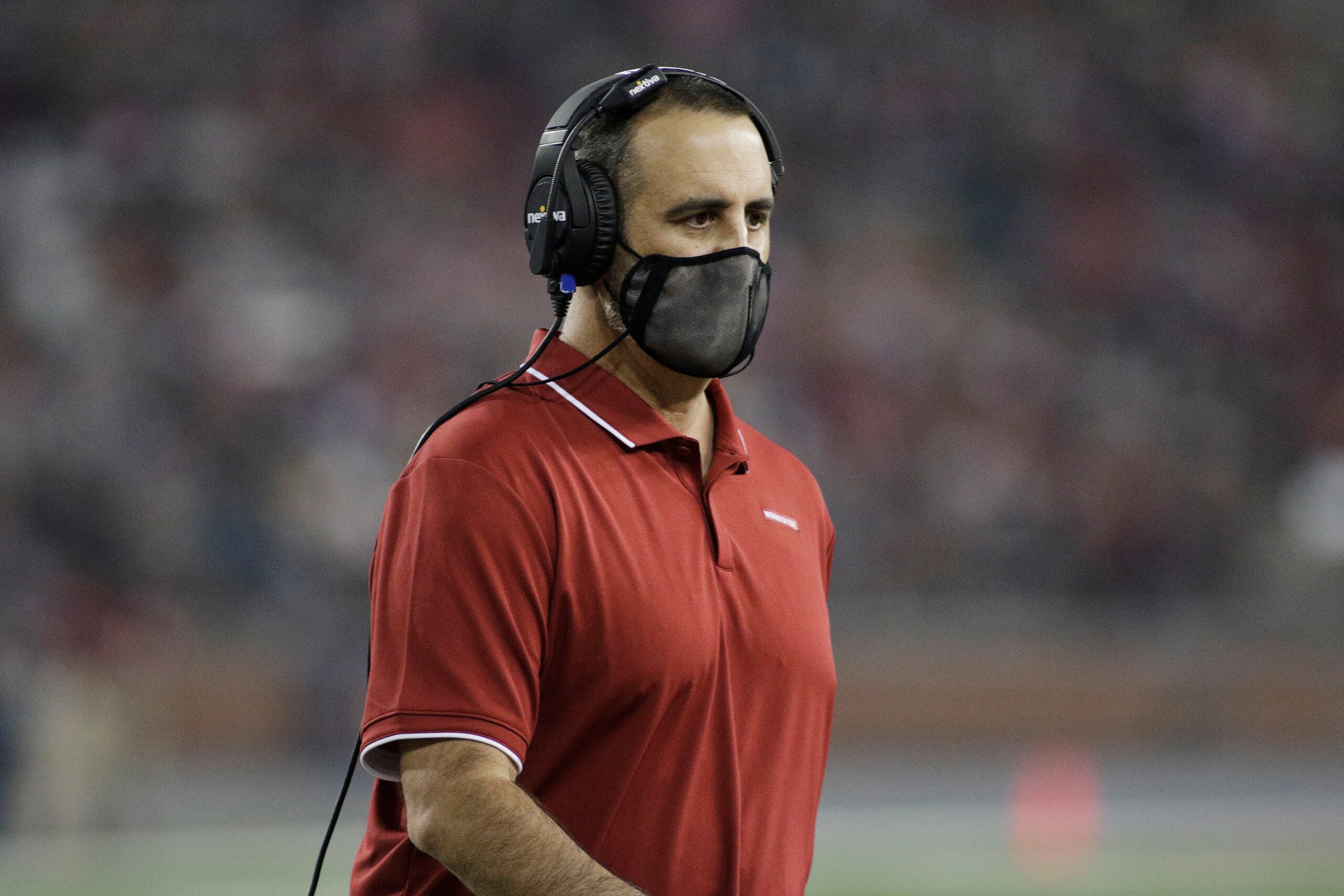 Washington State head coach Nick Rolovich walks not he field during the first half of an NCAA college football game against Utah State, Saturday, Sept. 4, 2021, in Pullman, Wash. (AP Photo/Young Kwak)
