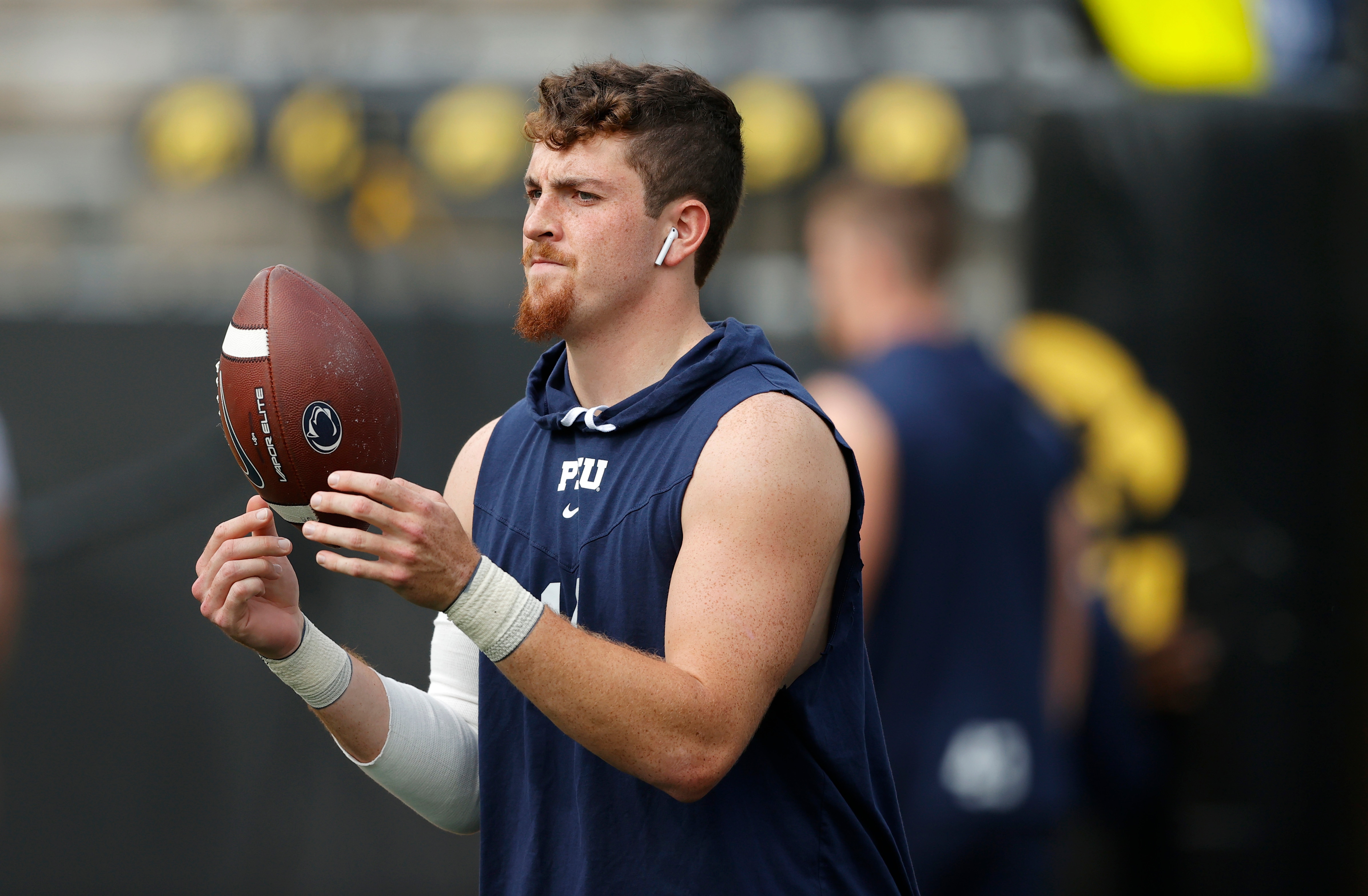 Penn State quarterback Sean Clifford (14) warms up before an NCAA college football game against Iowa, Saturday, Oct. 9, 2021, in Iowa City, Iowa. (AP Photo/Matthew Putney)