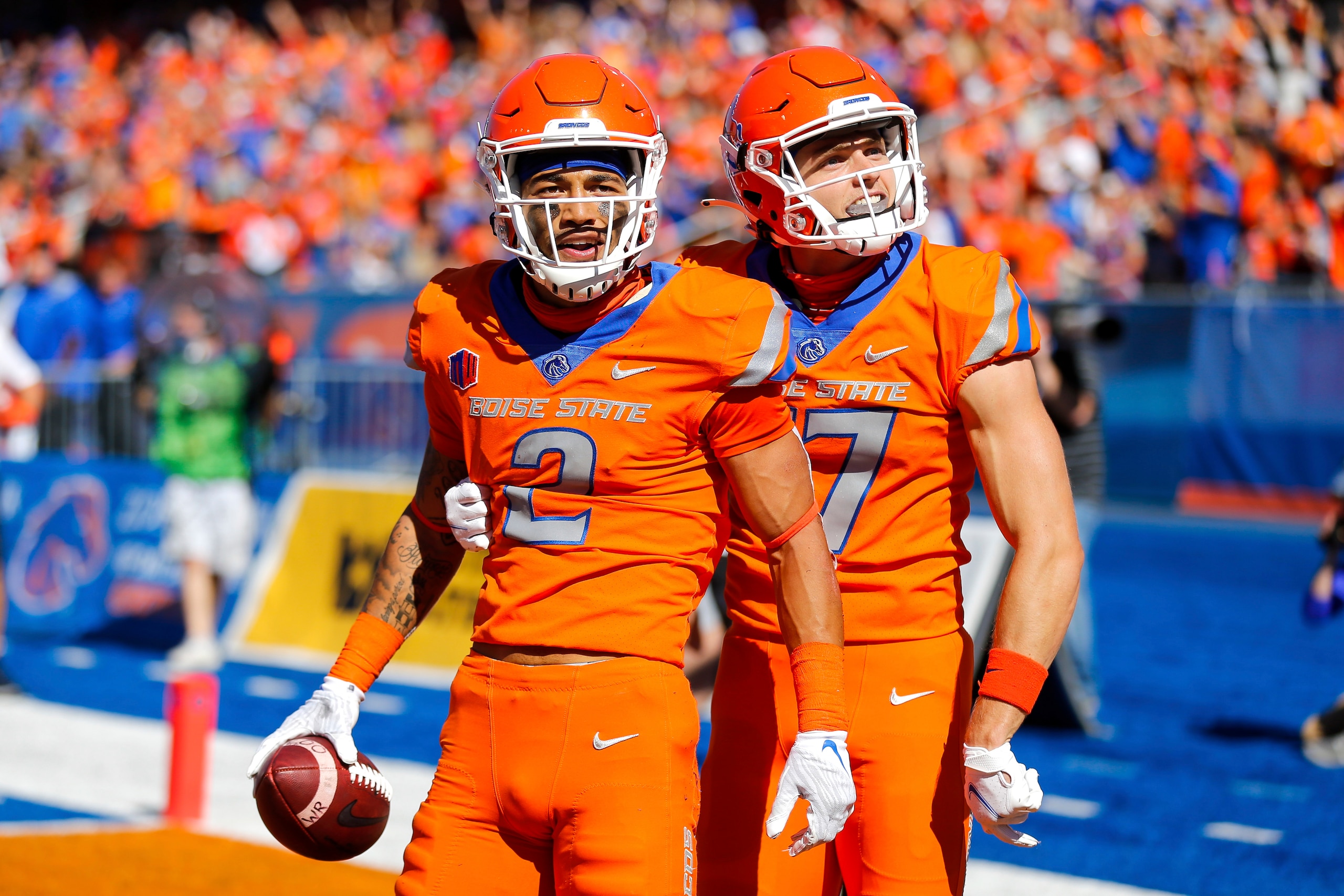 Boise State wide receiver Khalil Shakir (2) and wide receiver Davis Koetter (17) celebrate after a one-handed touchdown reception by Shakir in the first half of an NCAA college football game against Nevada, Saturday, Oct. 2, 2021, in Boise, Idaho. (AP Photo/Steve Conner)