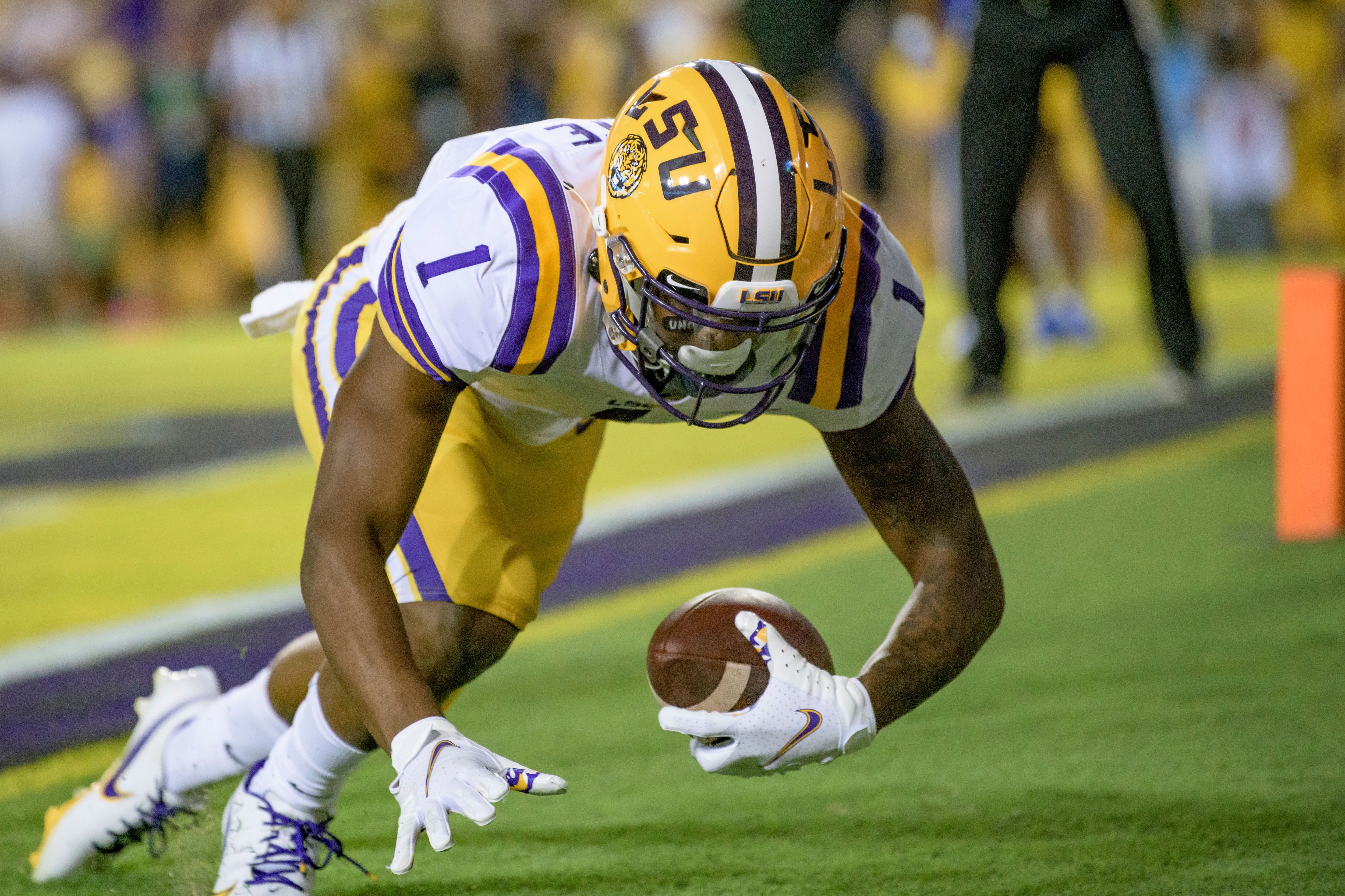 LSU wide receiver Kayshon Boutte scores a touchdown against McNeese State during the second half of an NCAA college football game in Baton Rouge, La., Saturday, Sept. 11, 2021. (AP Photo/Matthew Hinton)