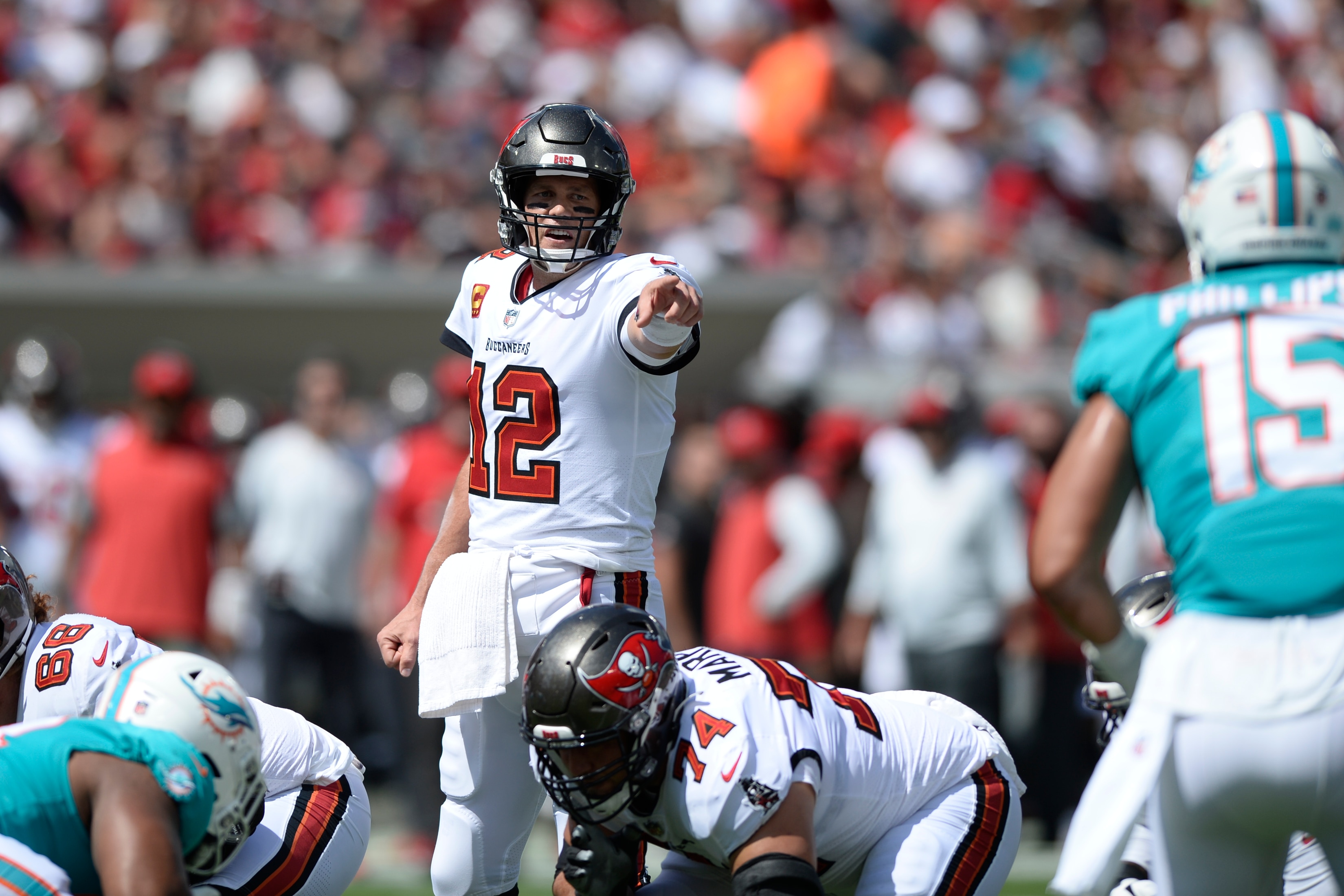 Tampa Bay Buccaneers quarterback Tom Brady (12) calls a play against the Miami Dolphins during the first half of an NFL football game Sunday, Oct. 10, 2021, in Tampa, Fla. (AP Photo/Jason Behnken)