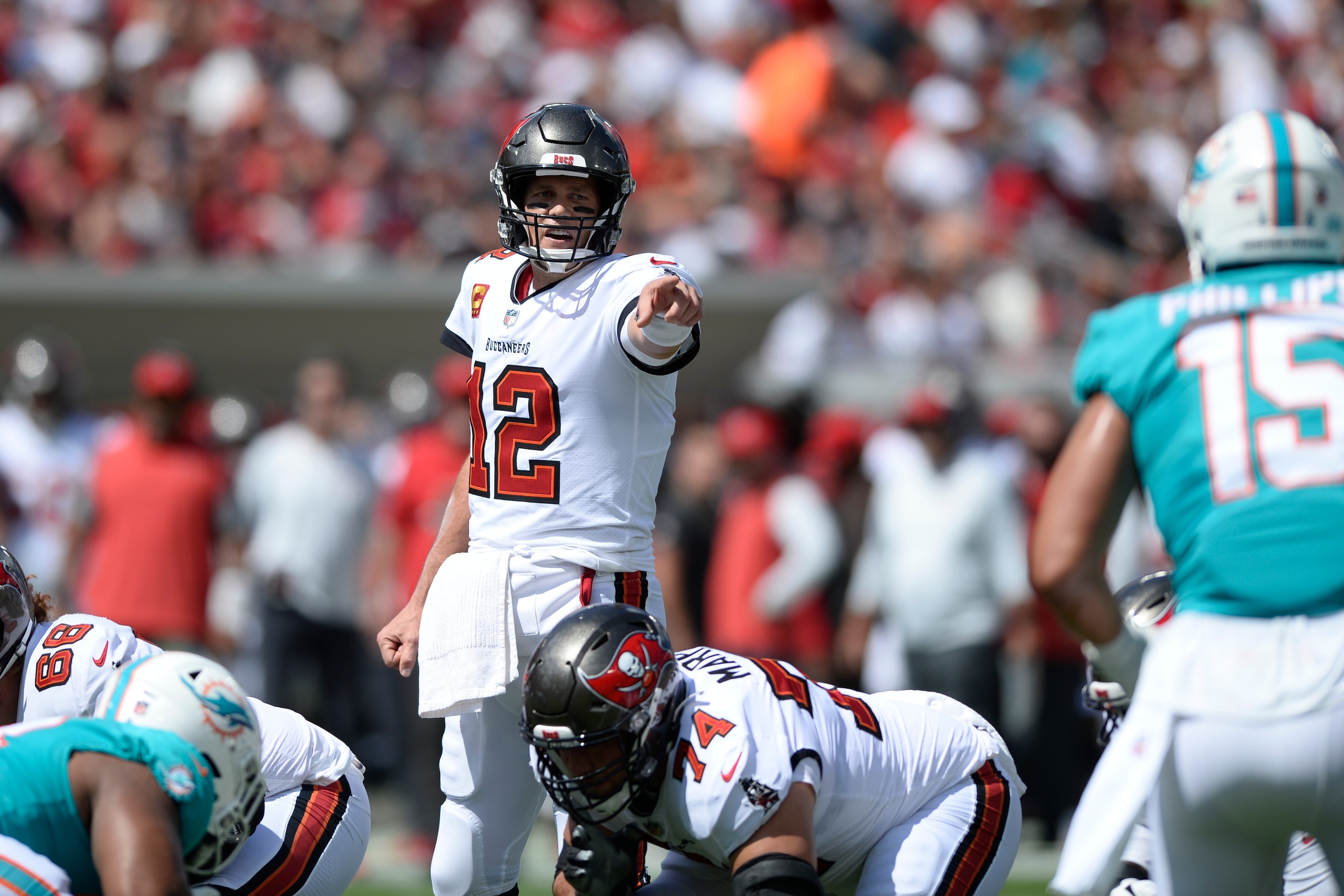Tampa Bay Buccaneers quarterback Tom Brady (12) calls a play against the Miami Dolphins during the first half of an NFL football game Sunday, Oct. 10, 2021, in Tampa, Fla. (AP Photo/Jason Behnken)