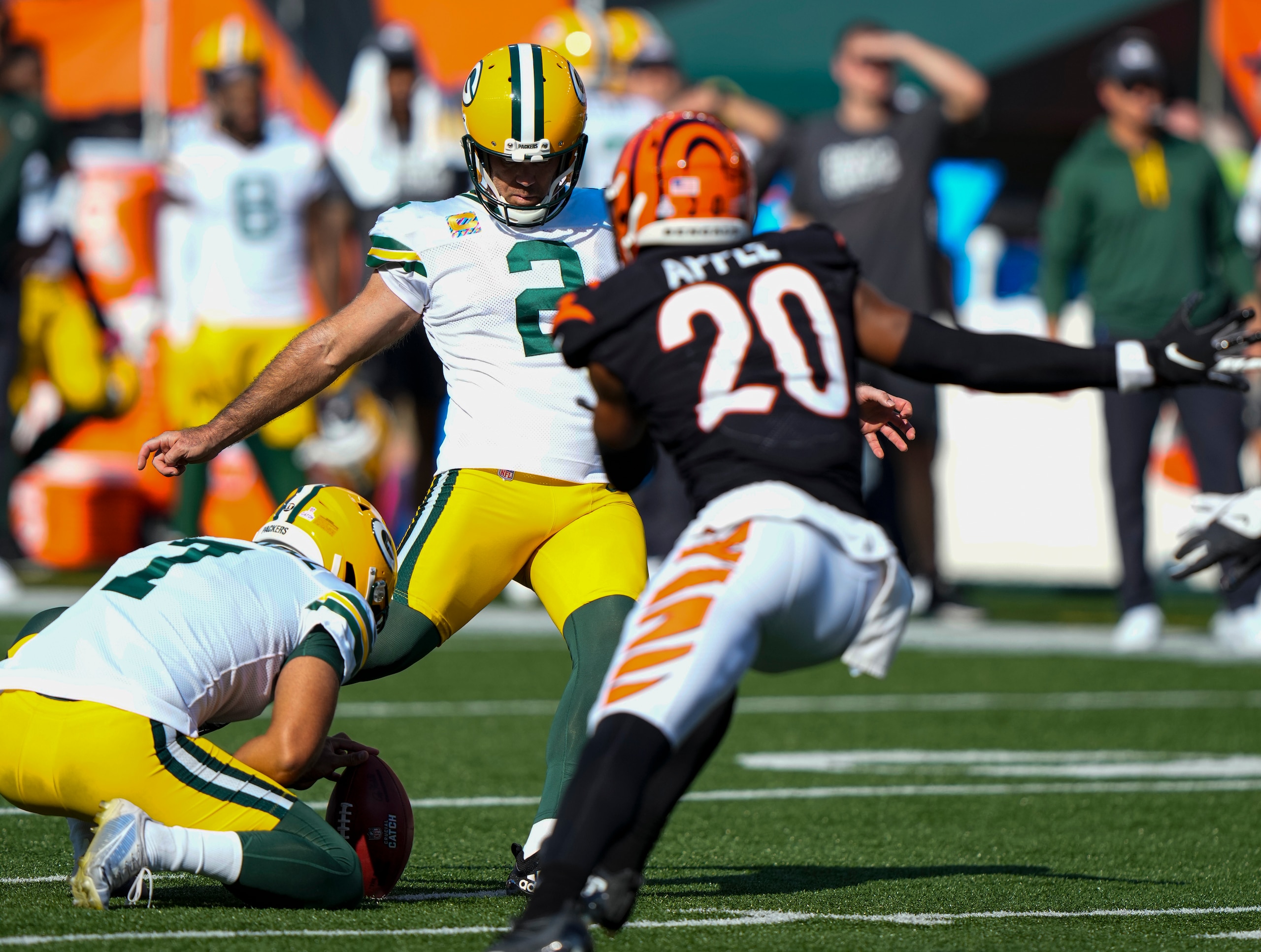 Green Bay Packers kicker Mason Crosby (2) misses a field goal from the hold of Corey Bojorquez in the second half of an NFL football game against the Cincinnati Bengals in Cincinnati, Sunday, Oct. 10, 2021. (AP Photo/AJ Mast)