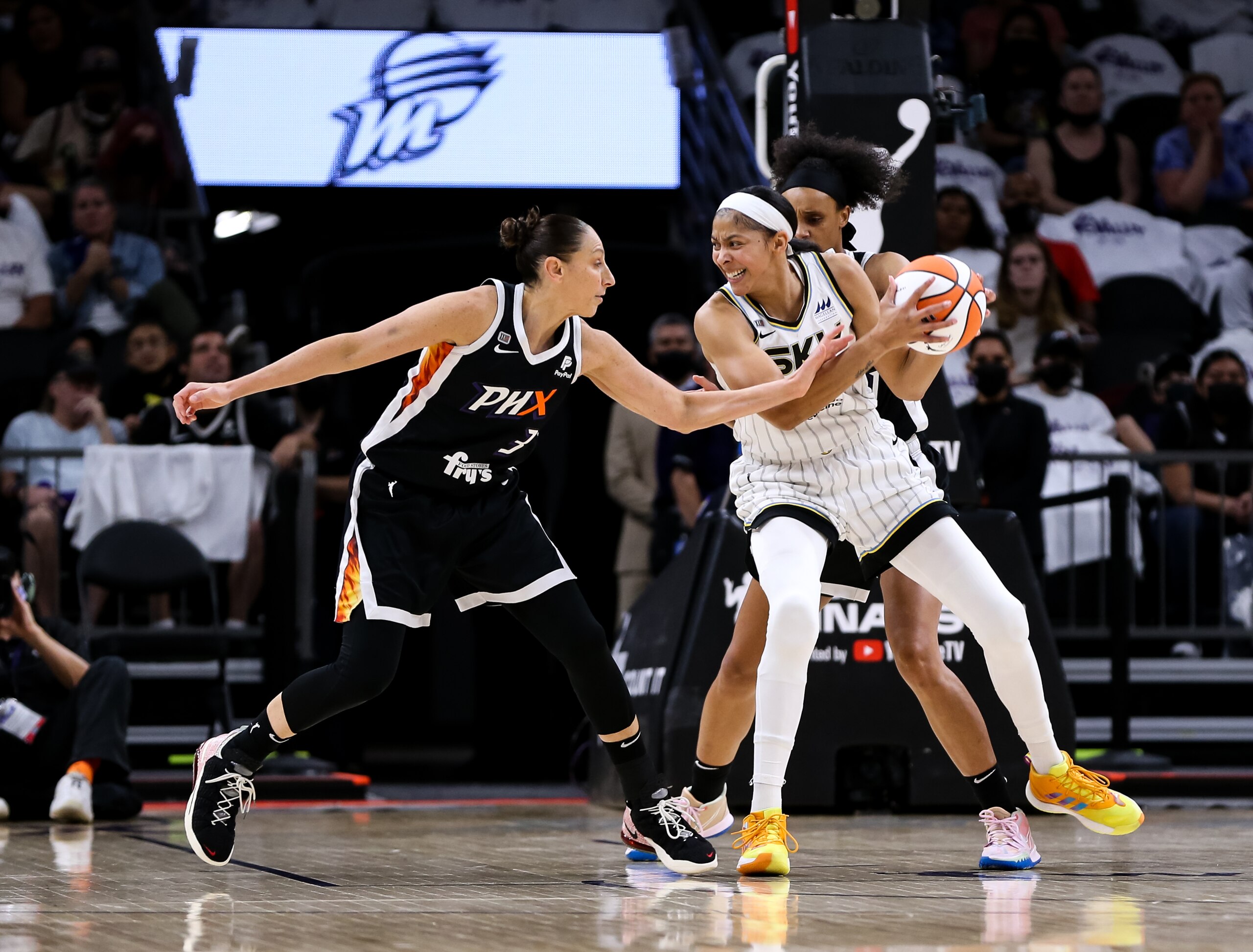 PHOENIX, ARIZONA - OCTOBER 10: Diana Taurasi #3 of the Phoenix Mercury fouls Candace Parker #3 of the Chicago Sky at Footprint Center on October 10, 2021 in Phoenix, Arizona. (Photo by Mike Mattina/Getty Images)