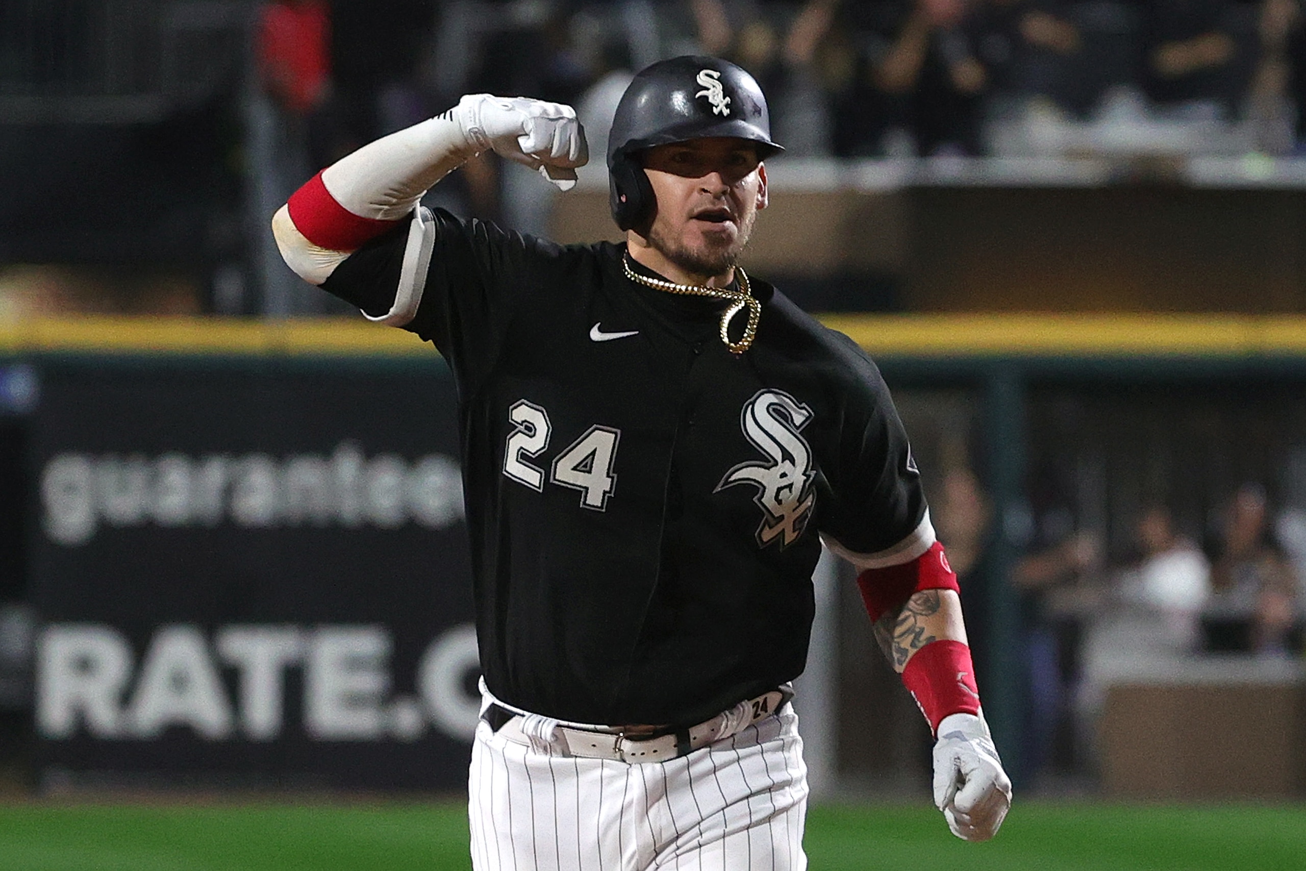 CHICAGO, ILLINOIS - OCTOBER 10: Yasmani Grandal #24 of the Chicago White Sox hits a two run home run in the third inning during game 3 of the American League Division Series against the Houston Astros at Guaranteed Rate Field on October 10, 2021 in Chicago, Illinois. (Photo by Stacy Revere/Getty Images)