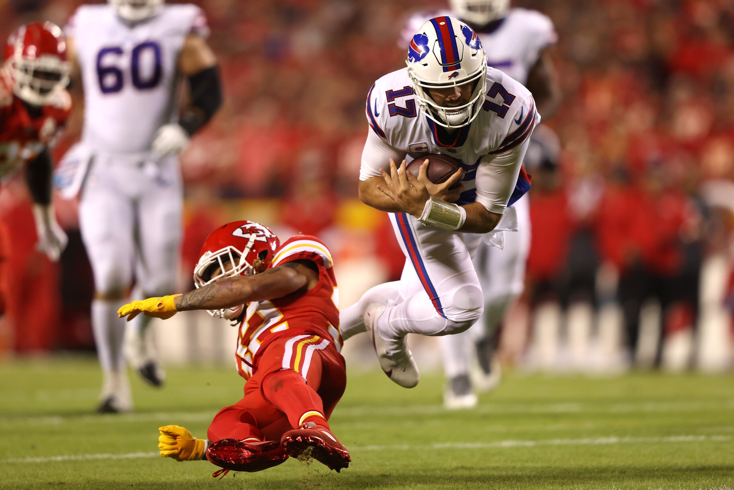 KANSAS CITY, MISSOURI - OCTOBER 10:  Josh Allen #17 of the Buffalo Bills is tackled by Tyrann Mathieu #32 of the Kansas City Chiefs during the first half of a game at Arrowhead Stadium on October 10, 2021 in Kansas City, Missouri. (Photo by Jamie Squire/Getty Images)
