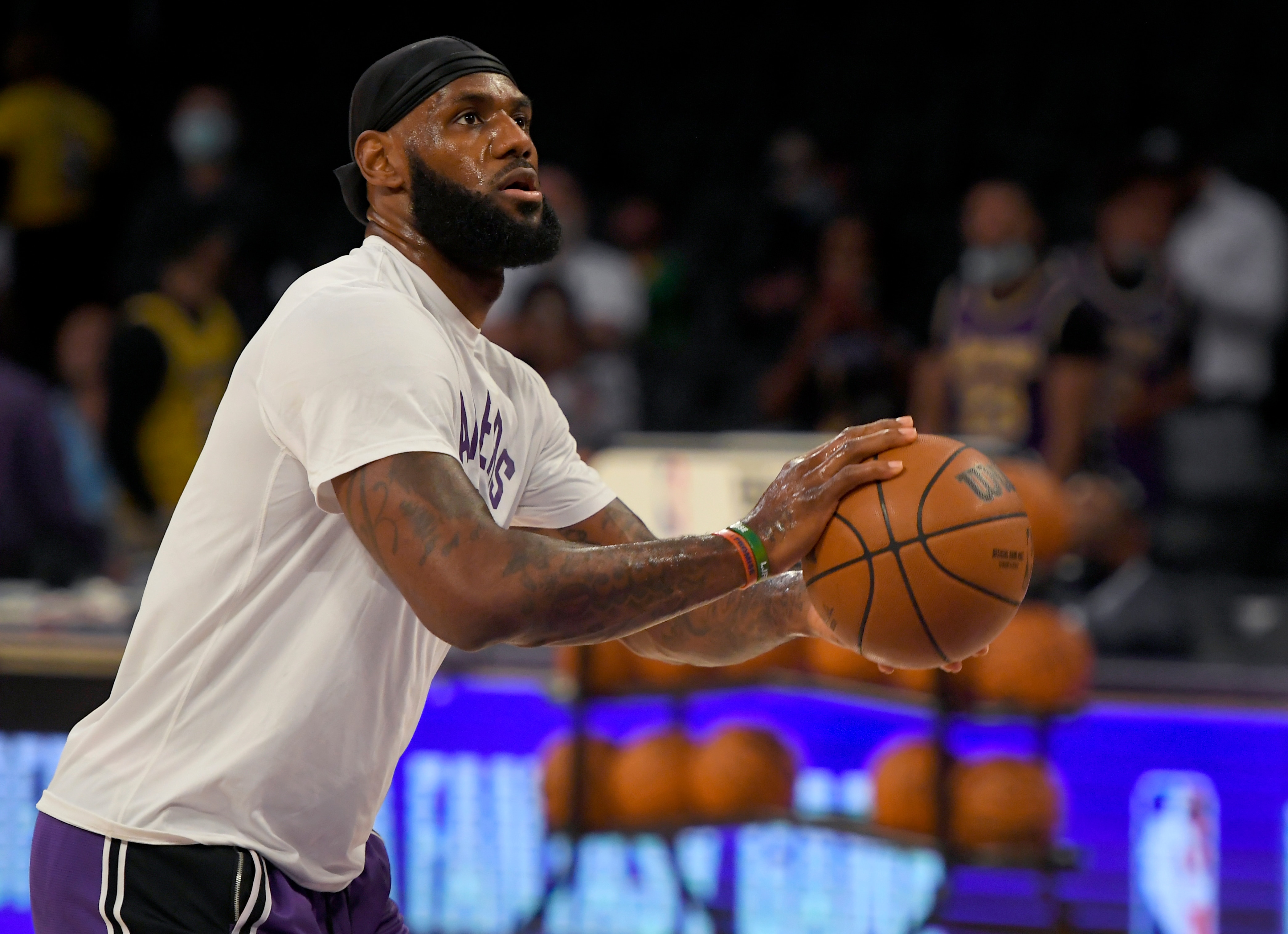 Los Angeles Lakers forward LeBron James (6) warms up before playing the Phoenix Suns in a preseason NBA basketball game in Los Angeles, Sunday, Oct. 10, 2021. (AP Photo/John McCoy)