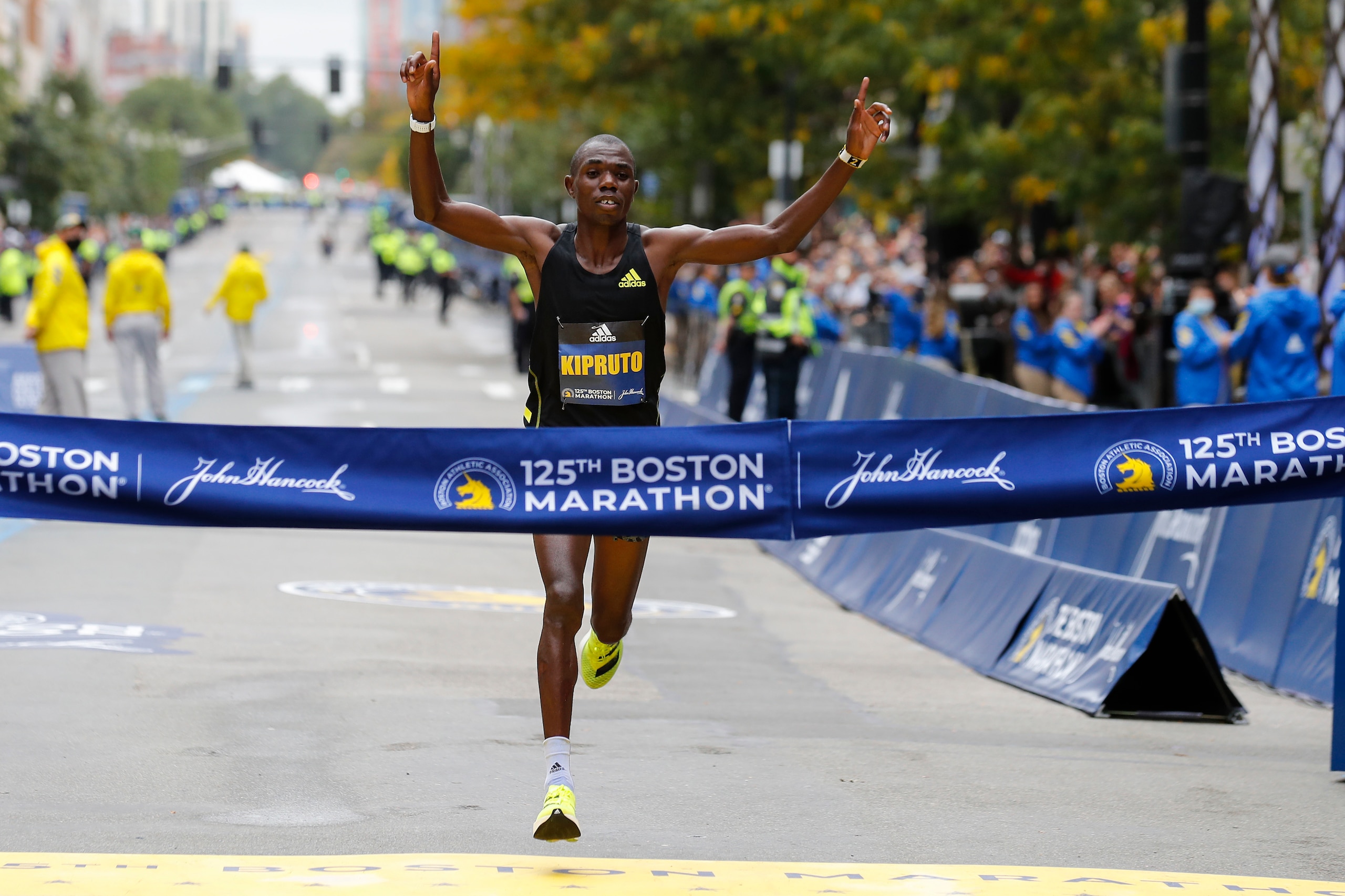 Benson Kipruto, of Kenya, approaches the tape to win the 125th Boston Marathon on Monday, Oct. 11, 2021, in Boston. (AP Photo/Winslow Townson)