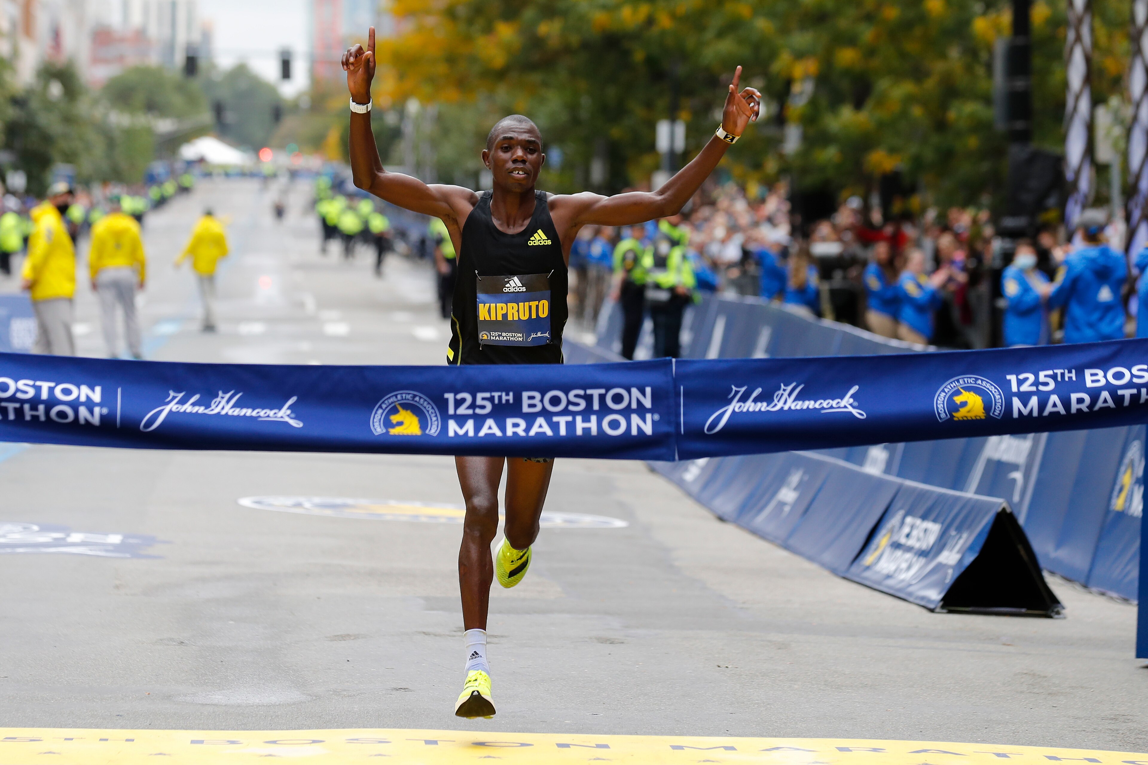 Benson Kipruto, of Kenya, approaches the tape to win the 125th Boston Marathon on Monday, Oct. 11, 2021, in Boston. (AP Photo/Winslow Townson)