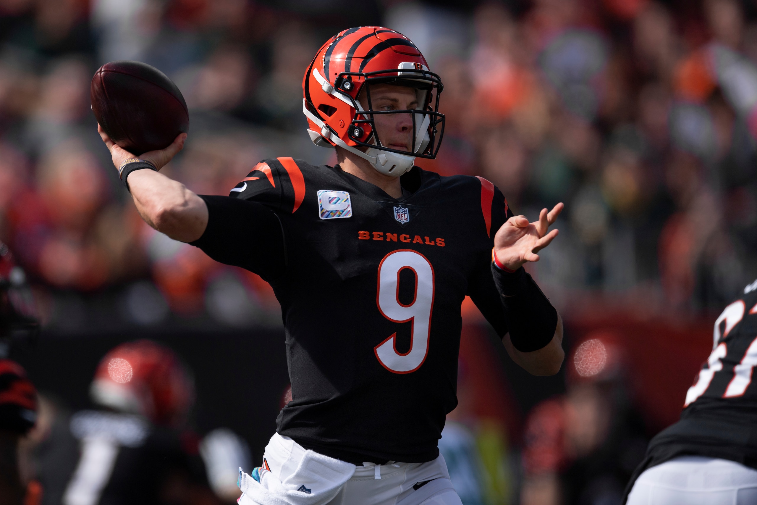 Cincinnati Bengals quarterback Joe Burrow (9) throws downfield during an NFL football game against the Green Bay Packers, Sunday, Oct. 10, 2021, in Cincinnati. (AP Photo/Zach Bolinger)