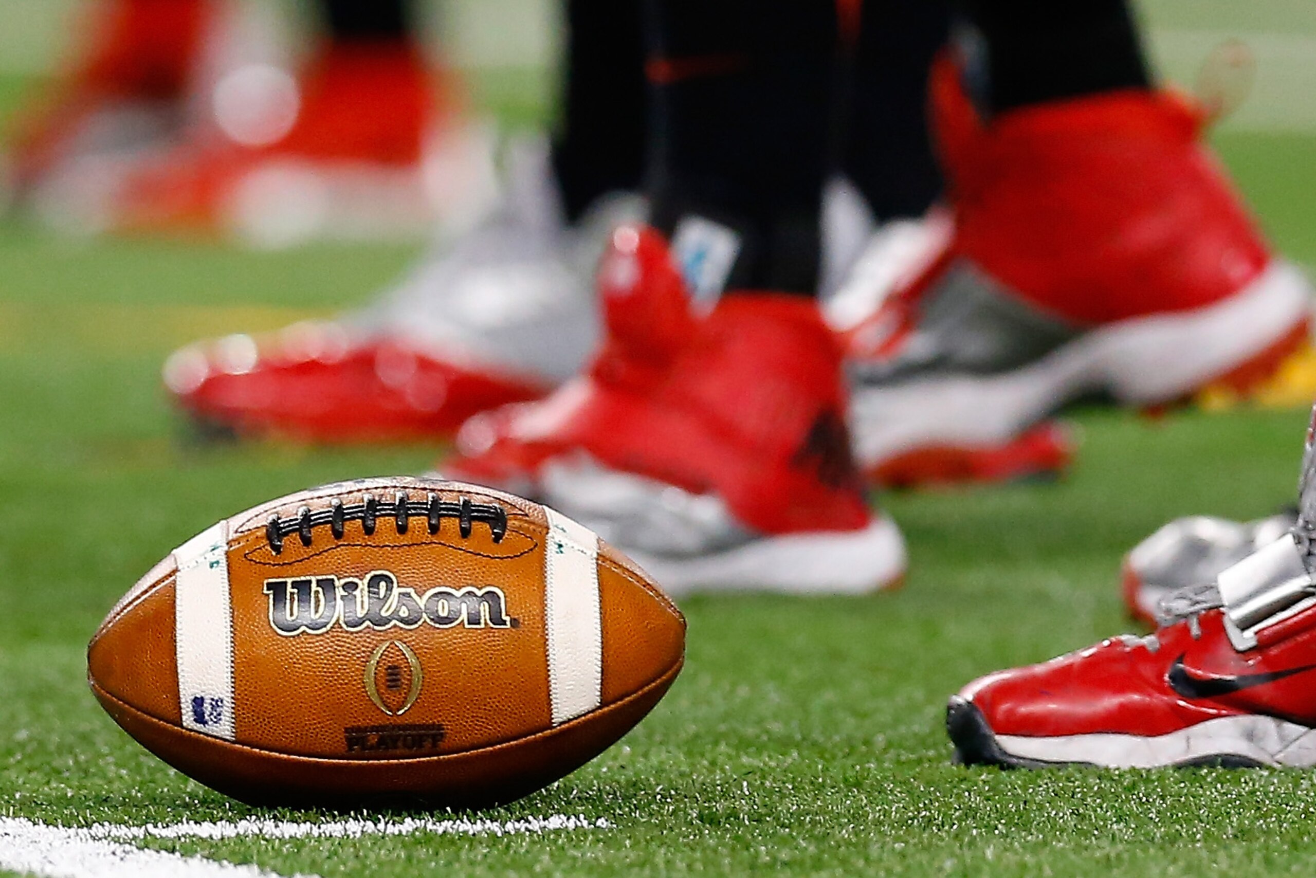 ARLINGTON, TX - JANUARY 12: Wilson footballs are seen on the field before the College Football Playoff National Championship Game at AT&T Stadium on January 12, 2015 in Arlington, Texas. (Photo by Tom Pennington/Getty Images) ARLINGTON, TX - JANUARY 12: Wilson footballs are seen on the field before the College Football Playoff National Championship Game at AT&T Stadium on January 12, 2015 in Arlington, Texas. (Photo by Tom Pennington/Getty Images)