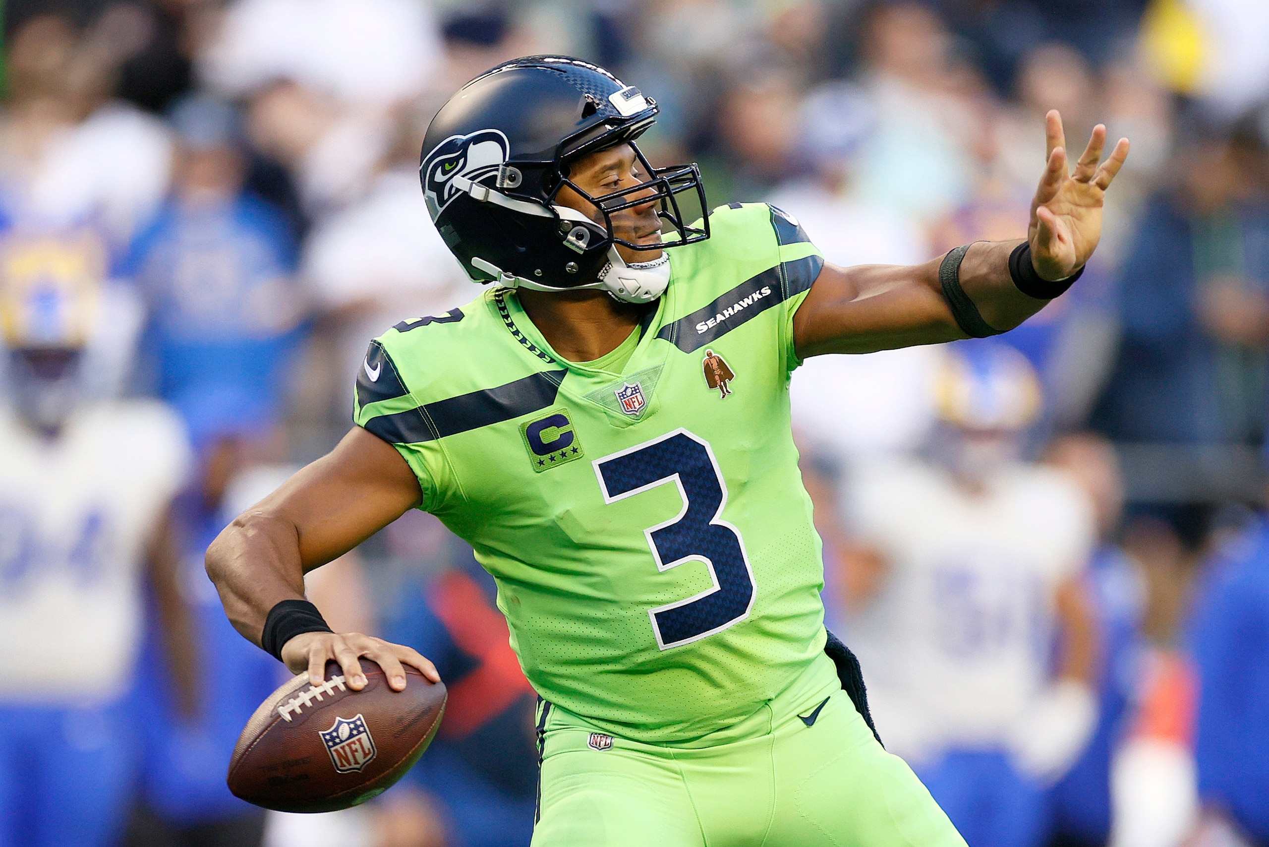SEATTLE, WASHINGTON - OCTOBER 07: Russell Wilson #3 of the Seattle Seahawks passes against the Los Angeles Rams during the first half at Lumen Field on October 07, 2021 in Seattle, Washington. (Photo by Steph Chambers/Getty Images)